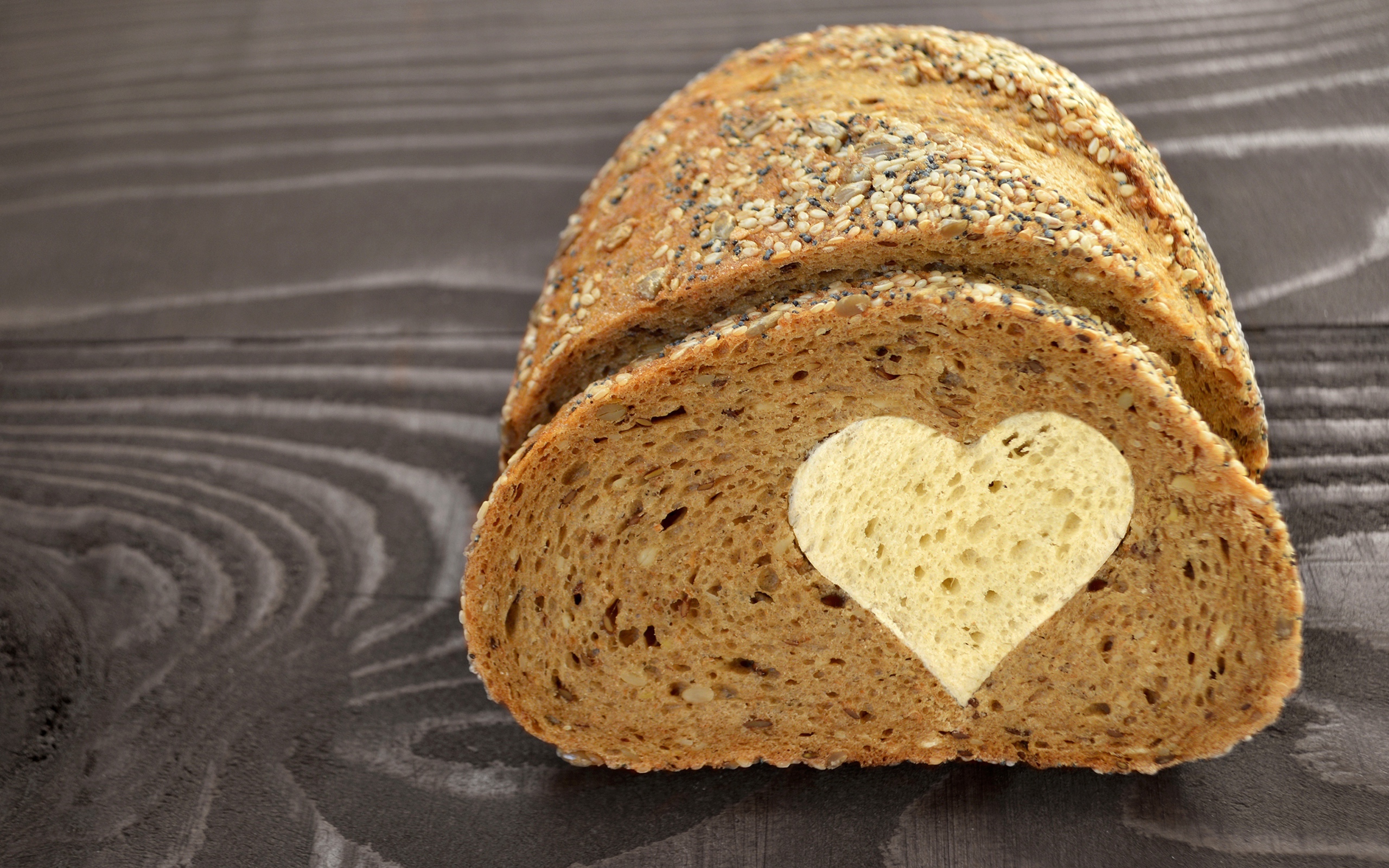 Rye bread with a white heart inside Desktop wallpaper 2560x1600