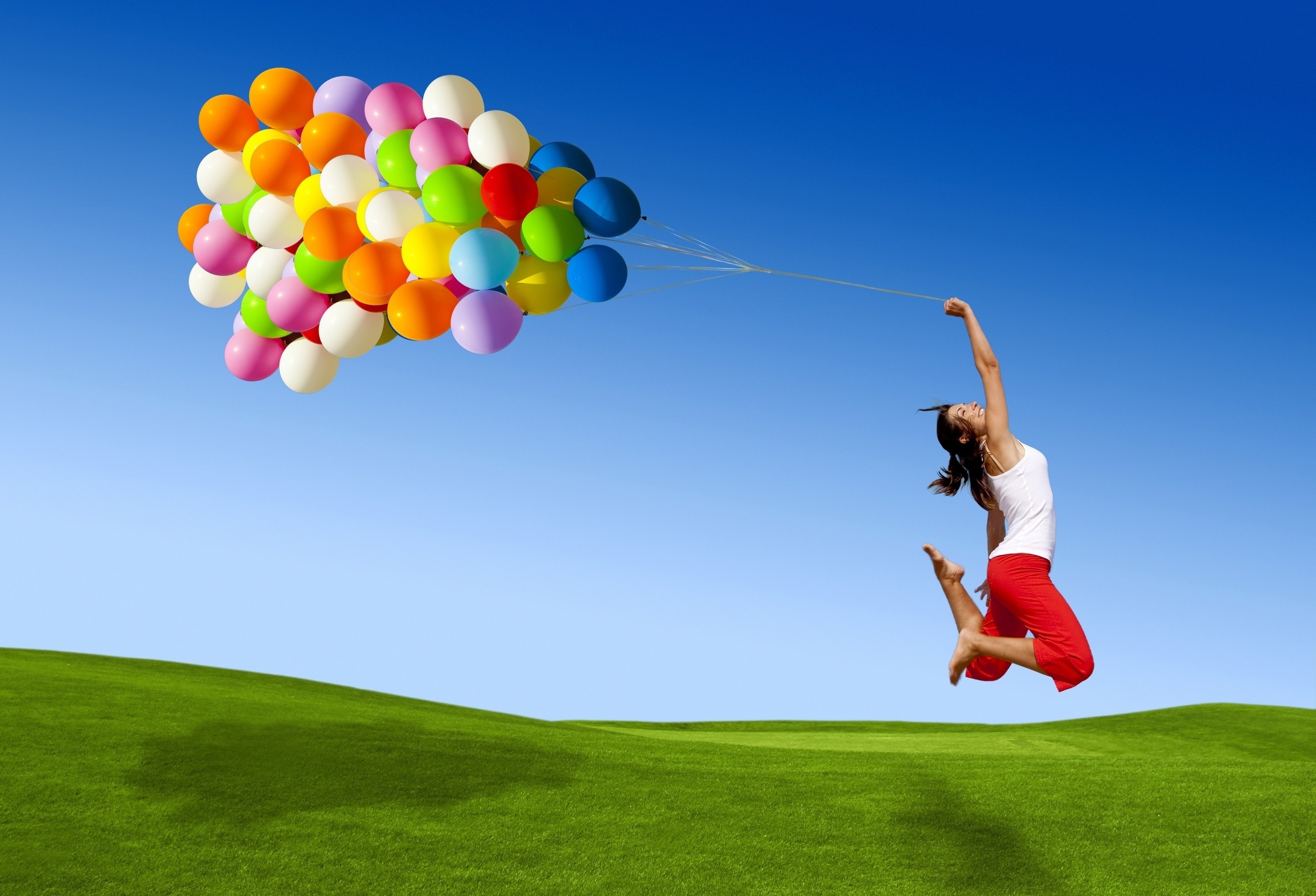 women model landscape nature balloons smiling jumping field grass sky colorful barefoot shadow wallpaper