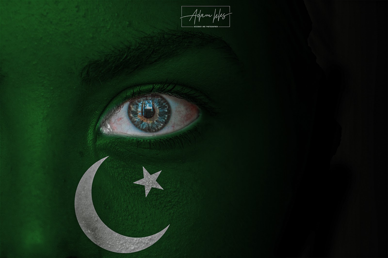 Photo of the flag of Pakistan on the face of a Child background