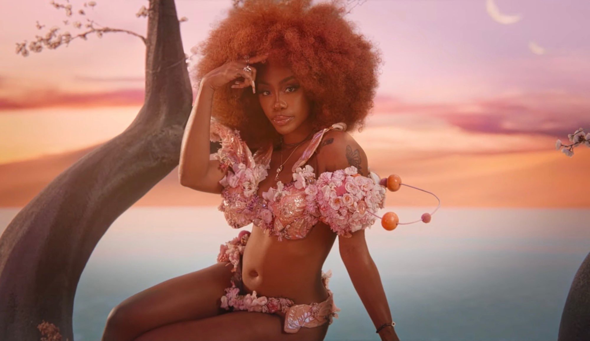 Doja Cat & SZA welcome us to Planet Her on Kiss Me More.