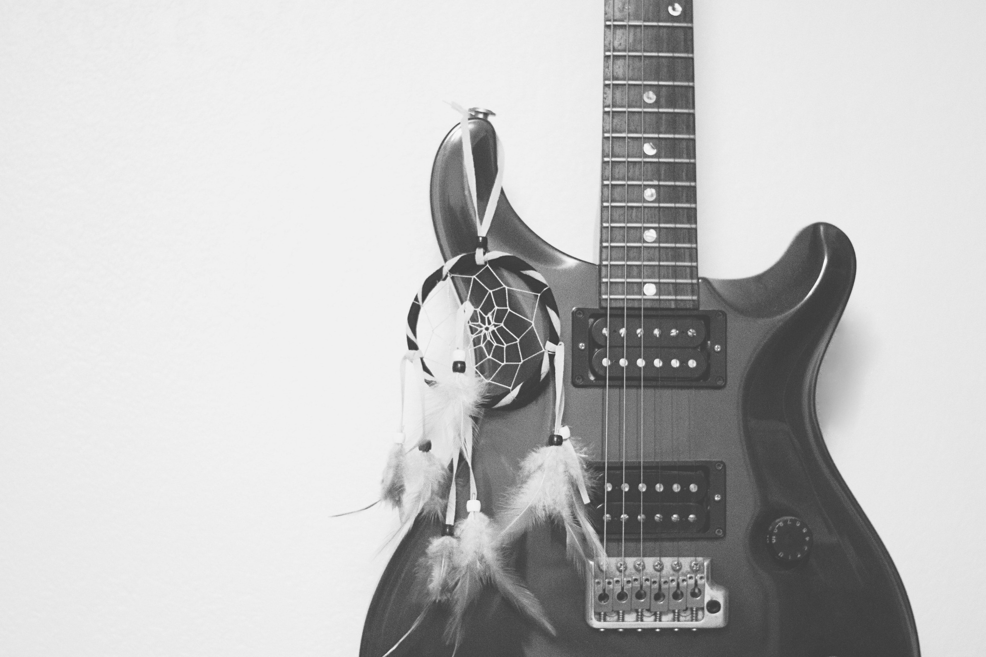Beautiful black guitar 4k wallpaper