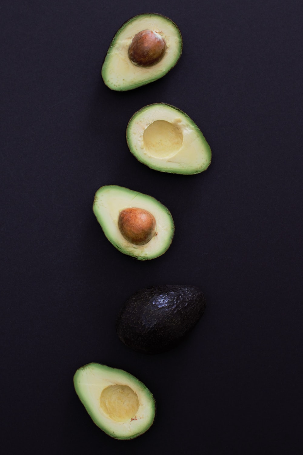sliced avocado fruits photo