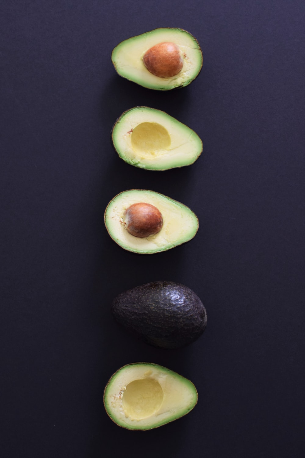 sliced avocado fruits photo