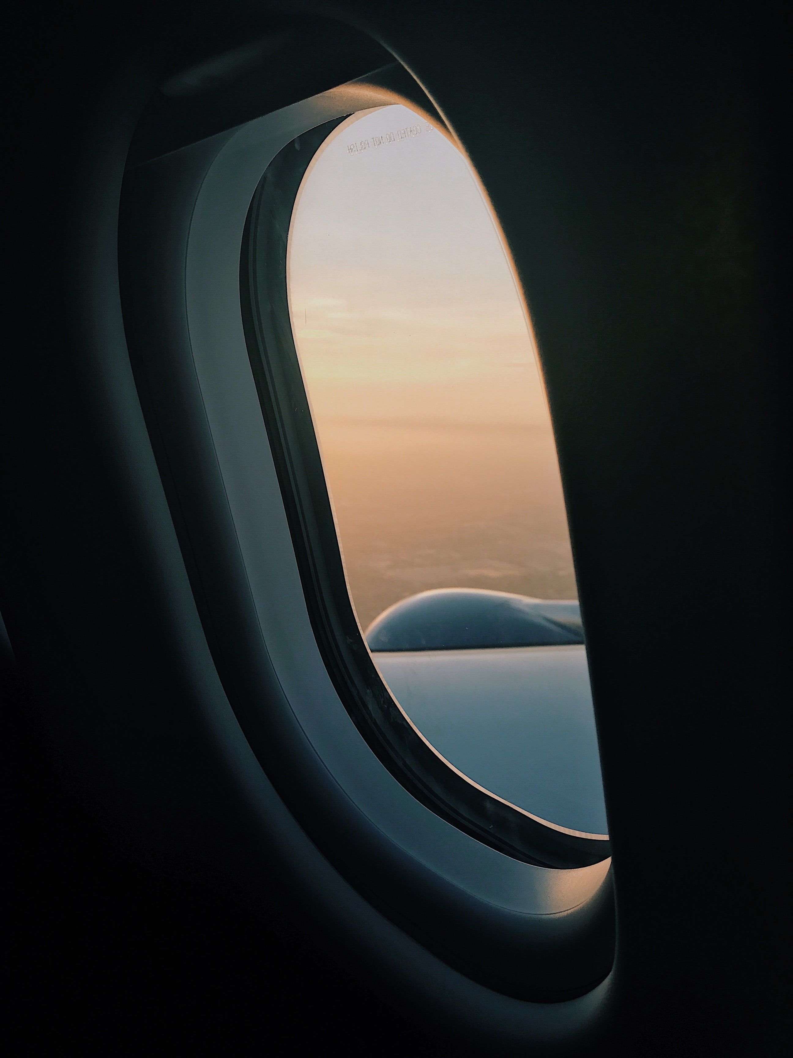 View through an airplane window on the sky at sunset. Lock screen background, iPhone 6s wallpaper, iPhone wallpaper