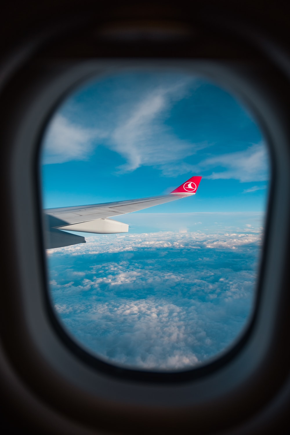 view of airplane's wing through window photo