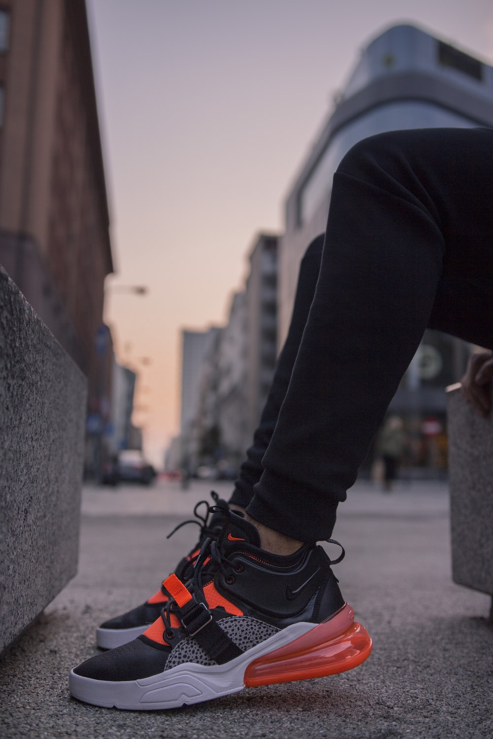 Person Wearing Black And Gray Nike Air Max 270 Shoes Photo