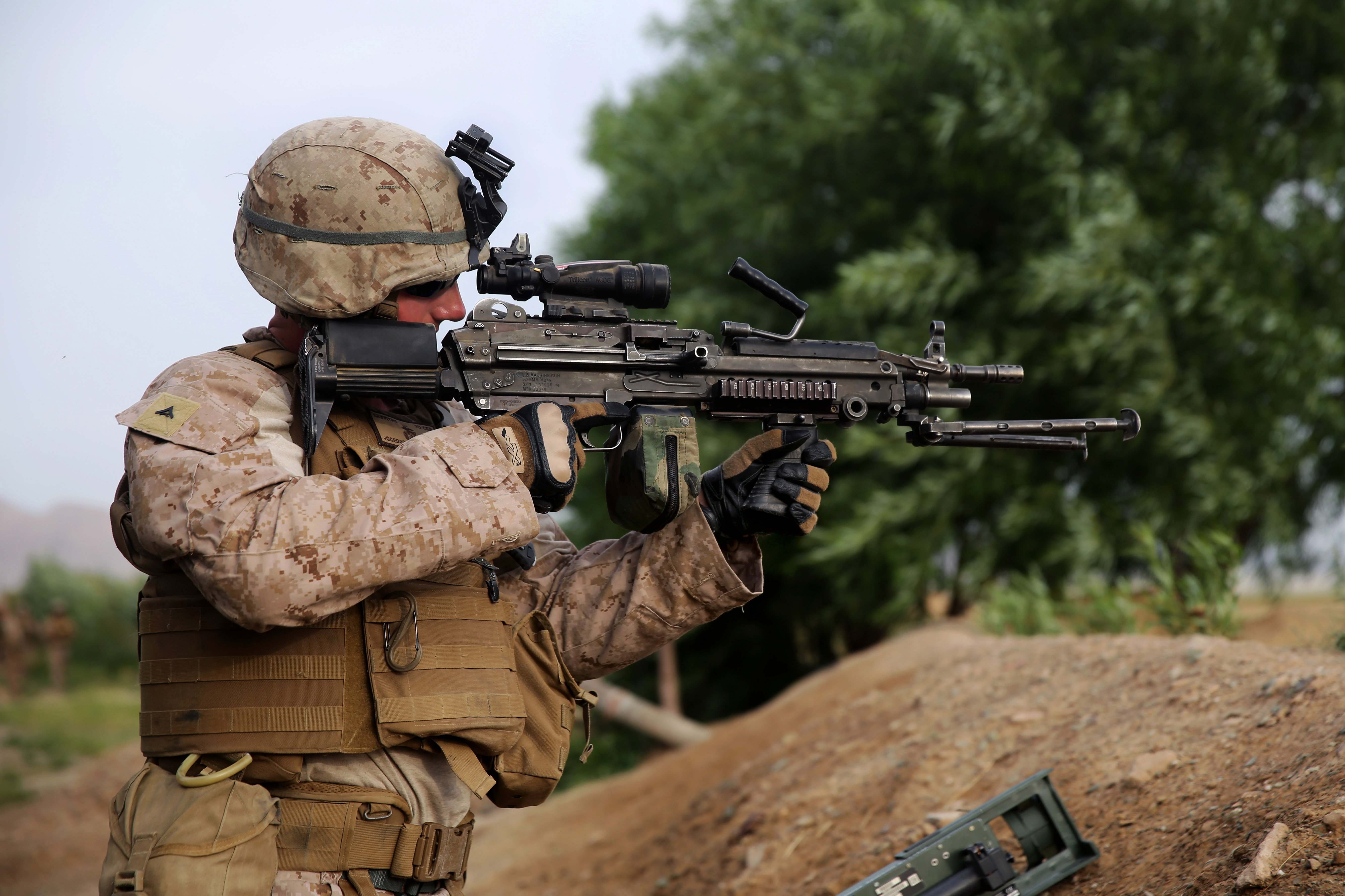 U.S. Marine Corps Lance Cpl. Jonathan Griffiths provides security with an M249 squad automatic weapon during