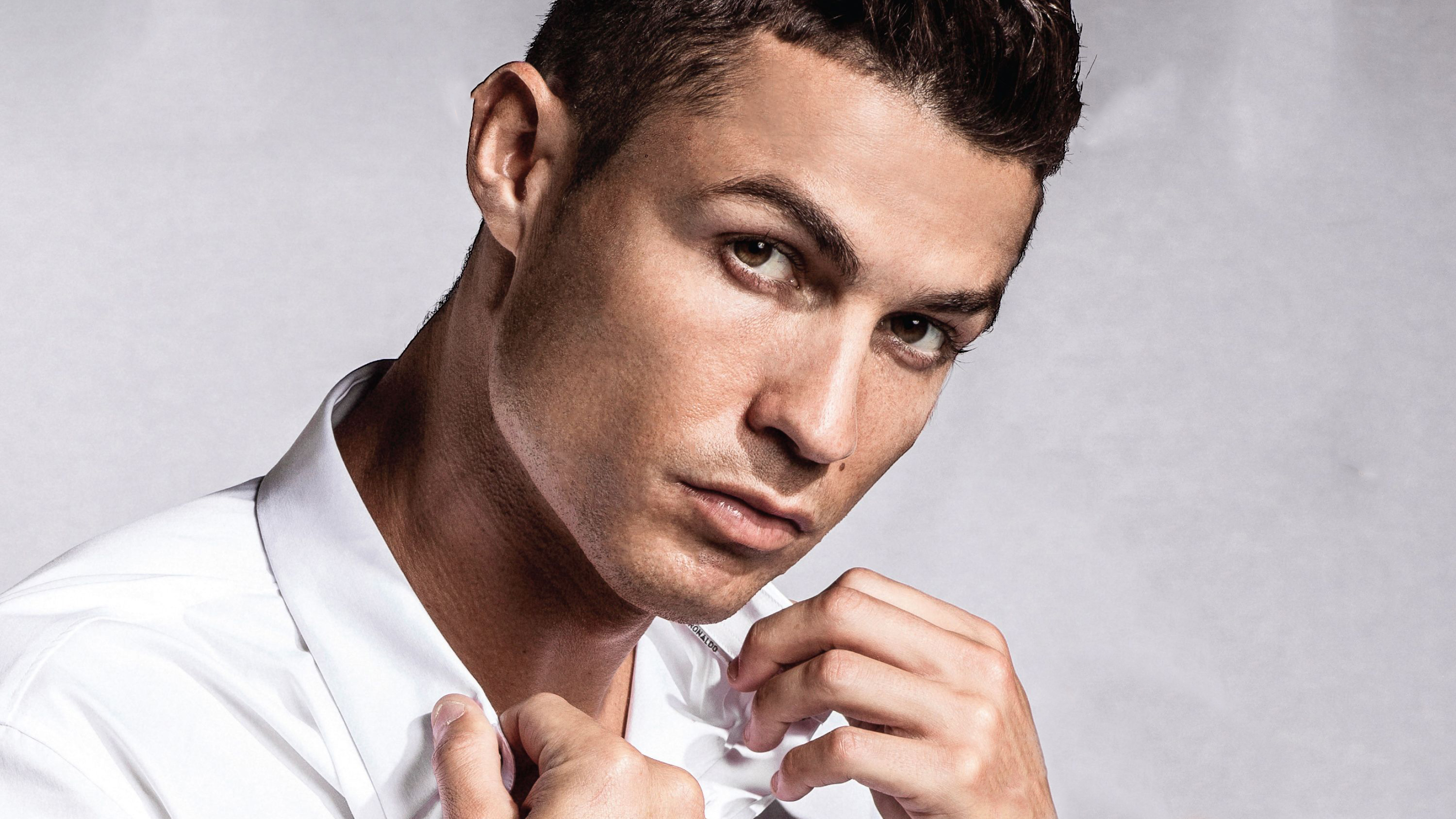 Portuguese soccer player Cristiano Ronaldo in a white shirt wallpaper and image, picture, photo