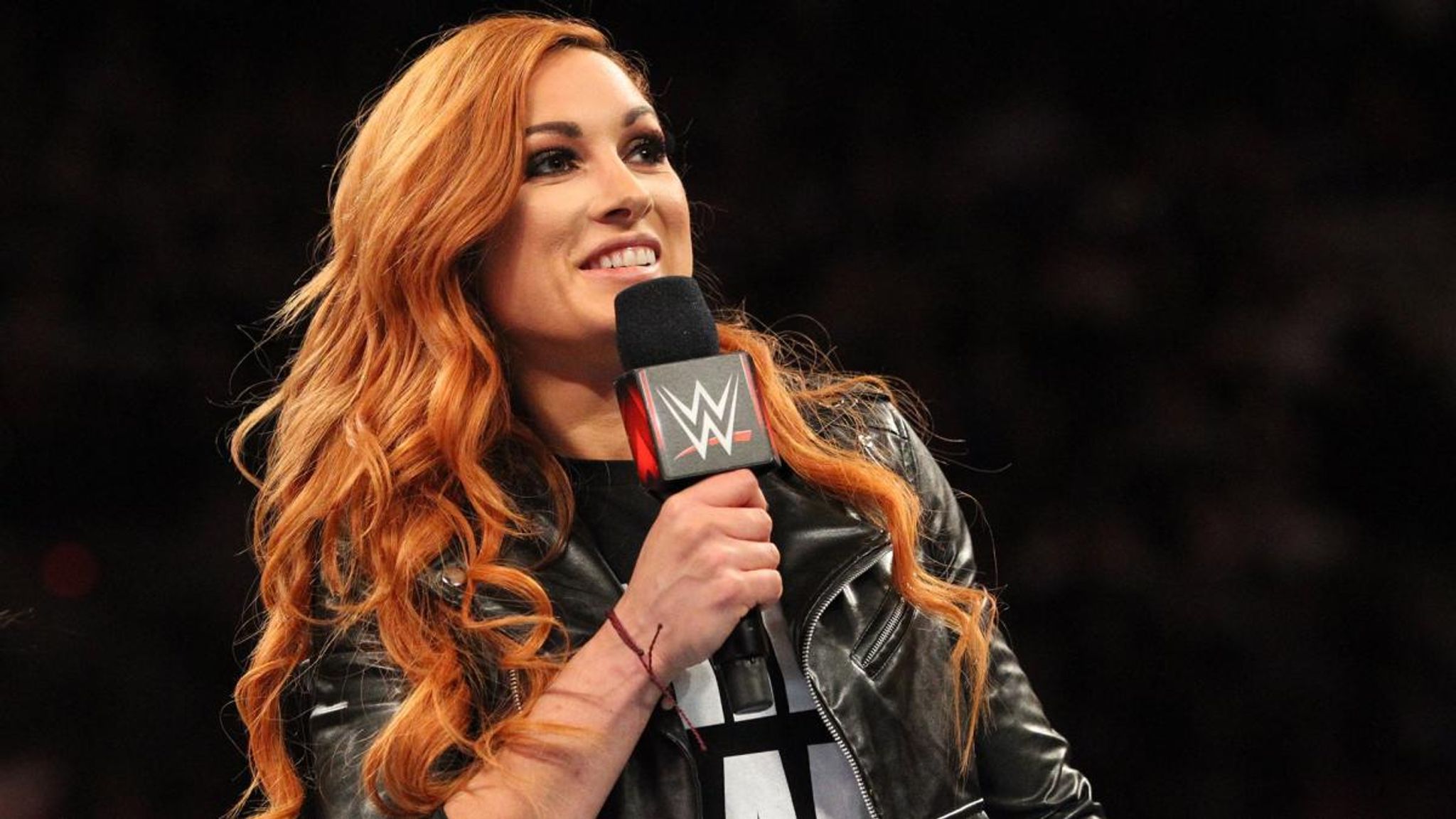 Becky Lynch attacks Charlotte Flair and Ronda Rousey with crutches!