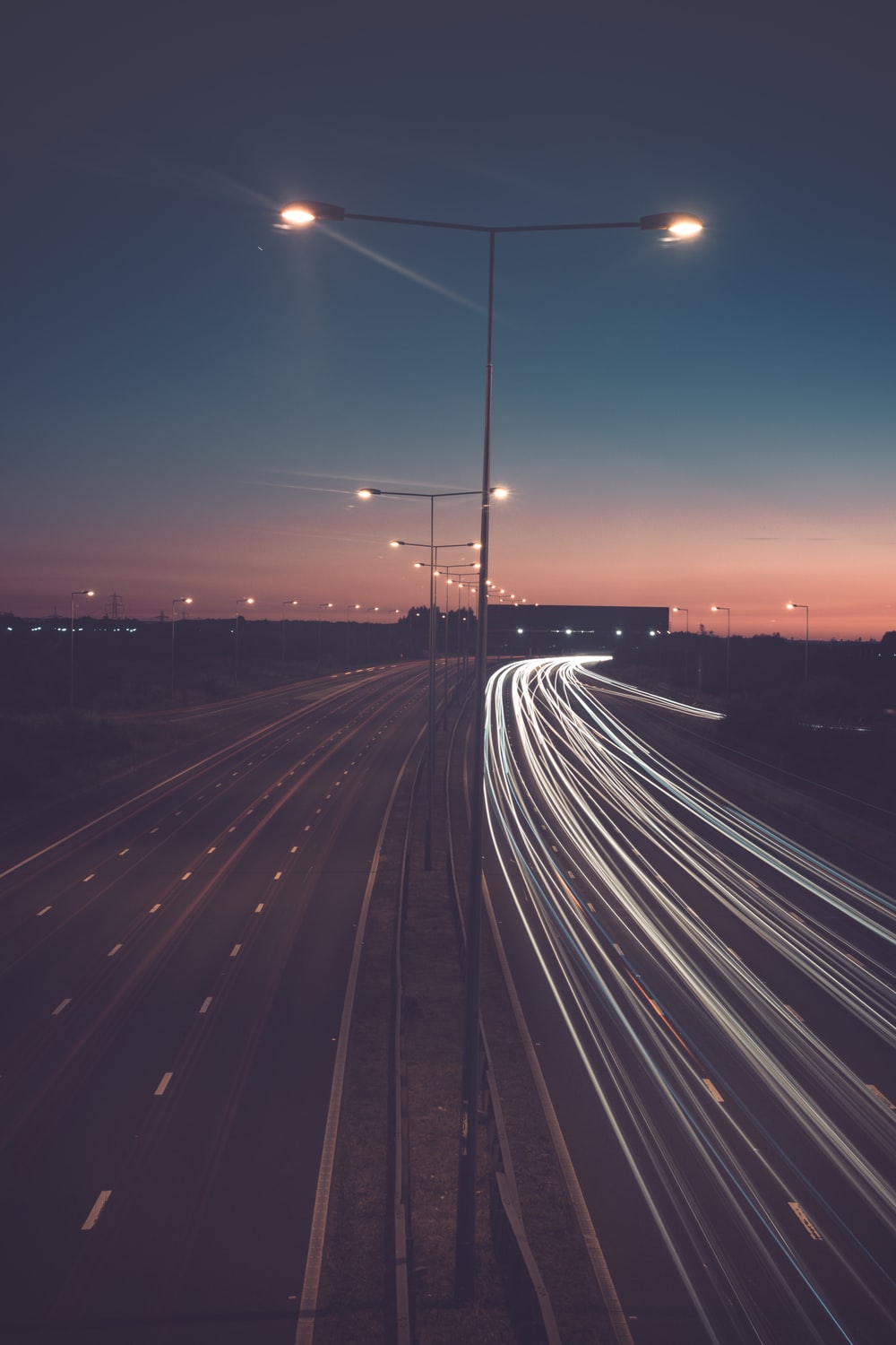 timelapse photography of road with street lights photo