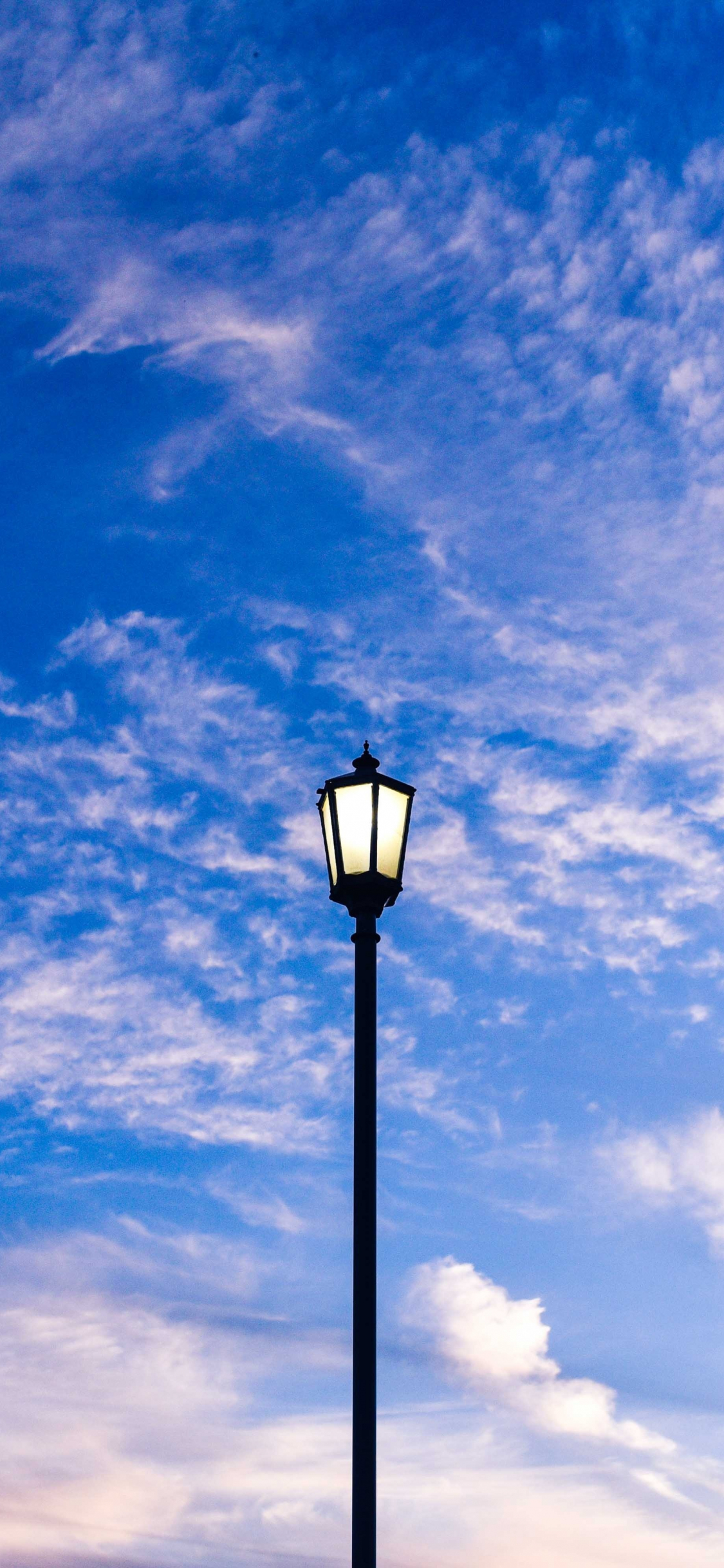 Download 1125x2436 wallpaper street light, blue sky, iphone x 1125x2436 HD image, background, 19653