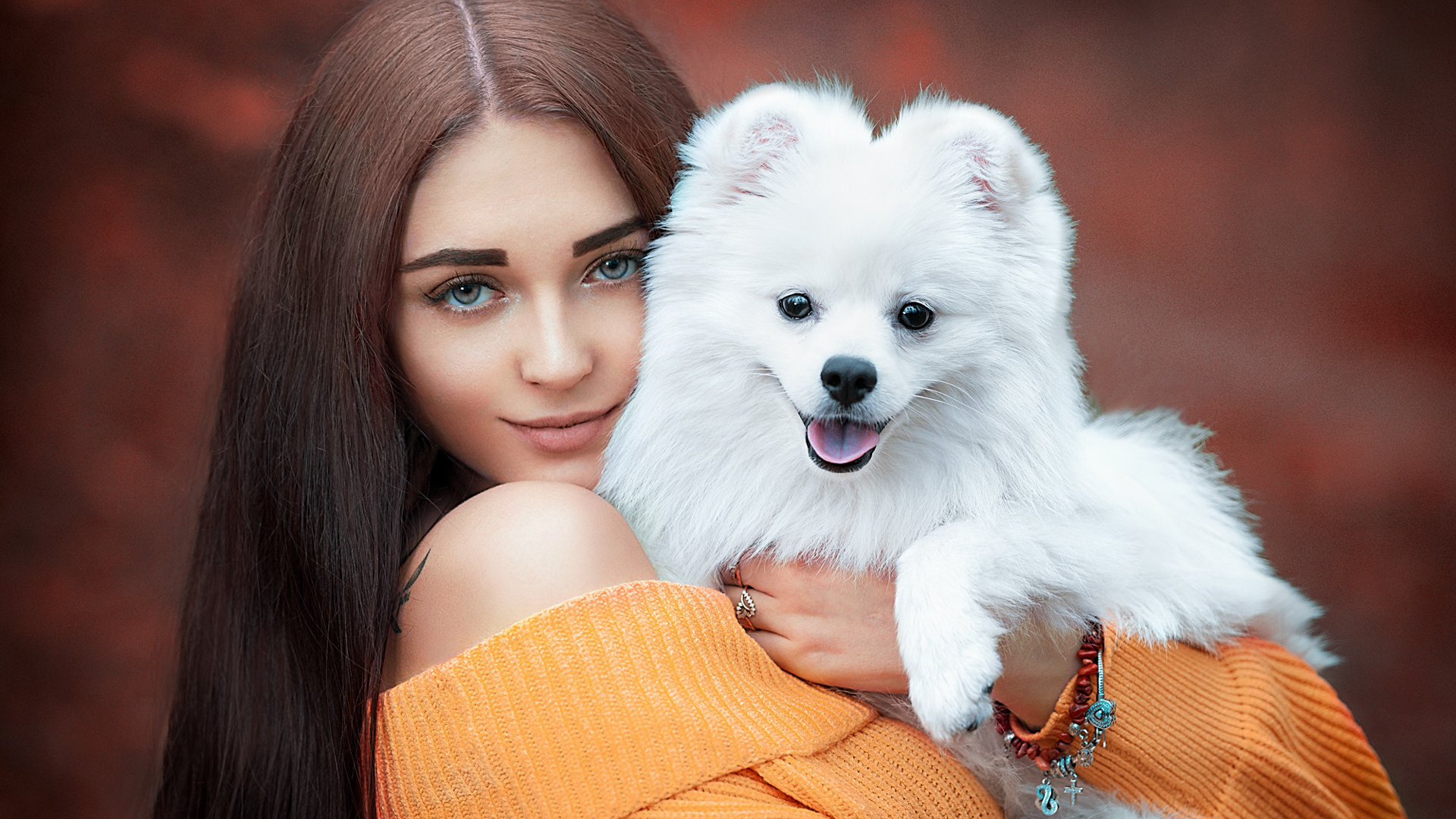 Beautiful Girl Model With White Dog Puppy Is Wearing Orange Dress In Blur Background HD Girls Wallpaper