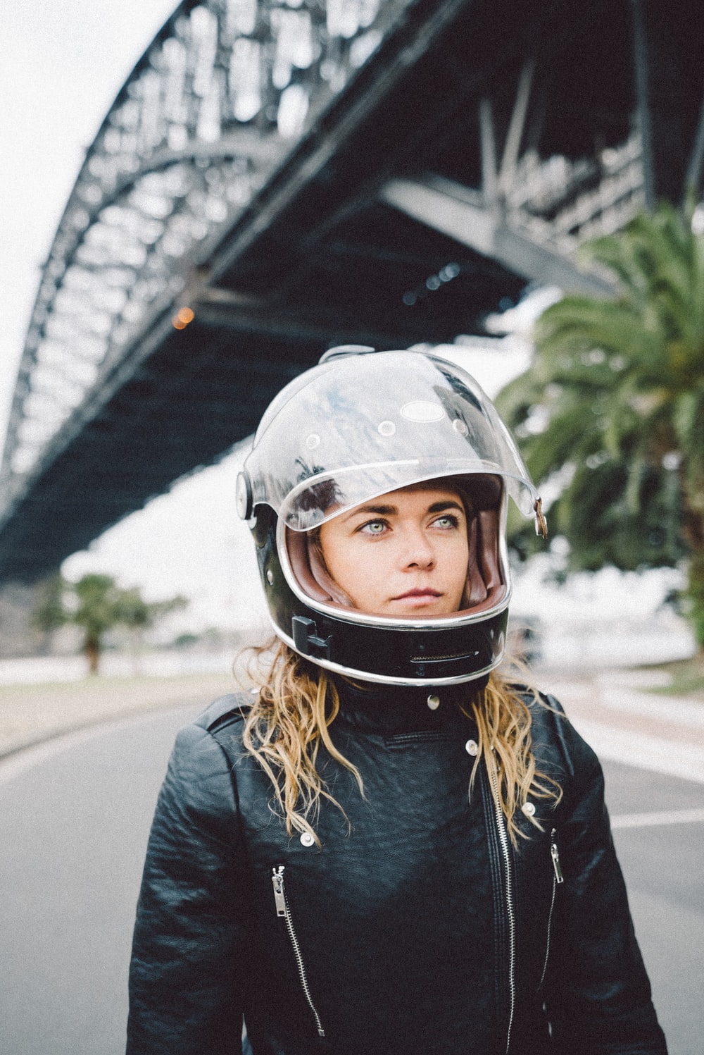 Woman Wearing Black Full Face Helmet And Black Jacket Photo