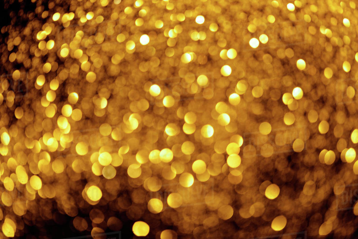 Abstract background with blurred gold glitter