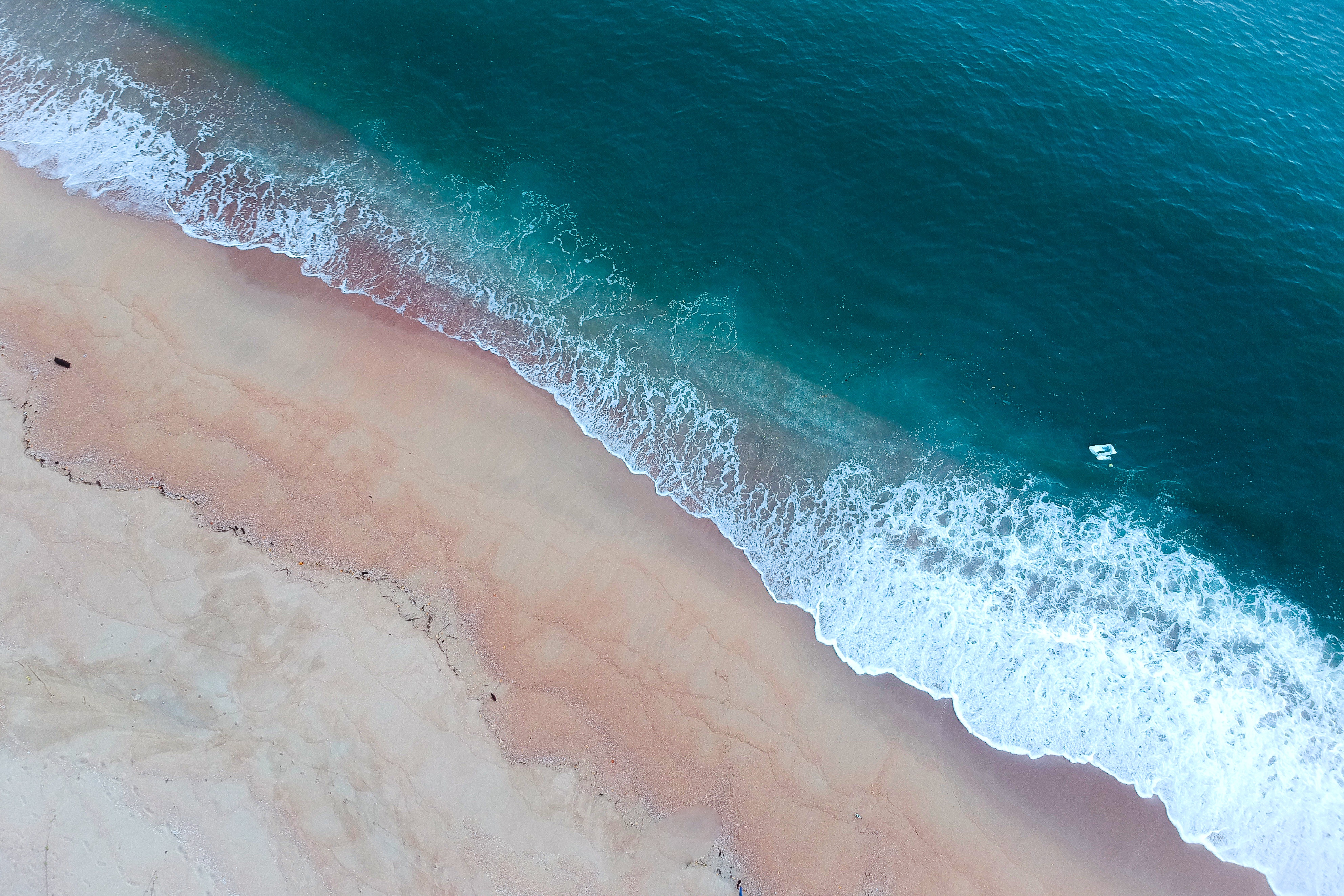 Aerial Shot Of Ocean Waves On Shore · Free