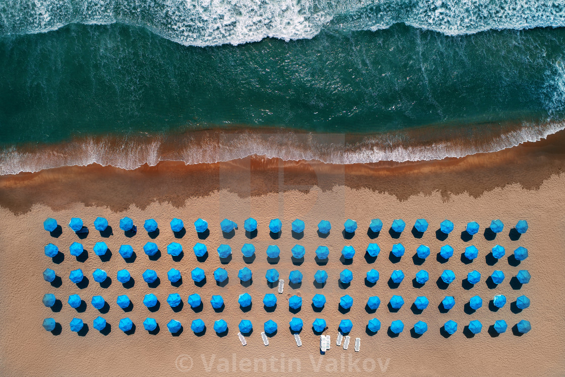 Aerial top view on the beach. Umbrellas, sand and sea waves, download or print for £20.00