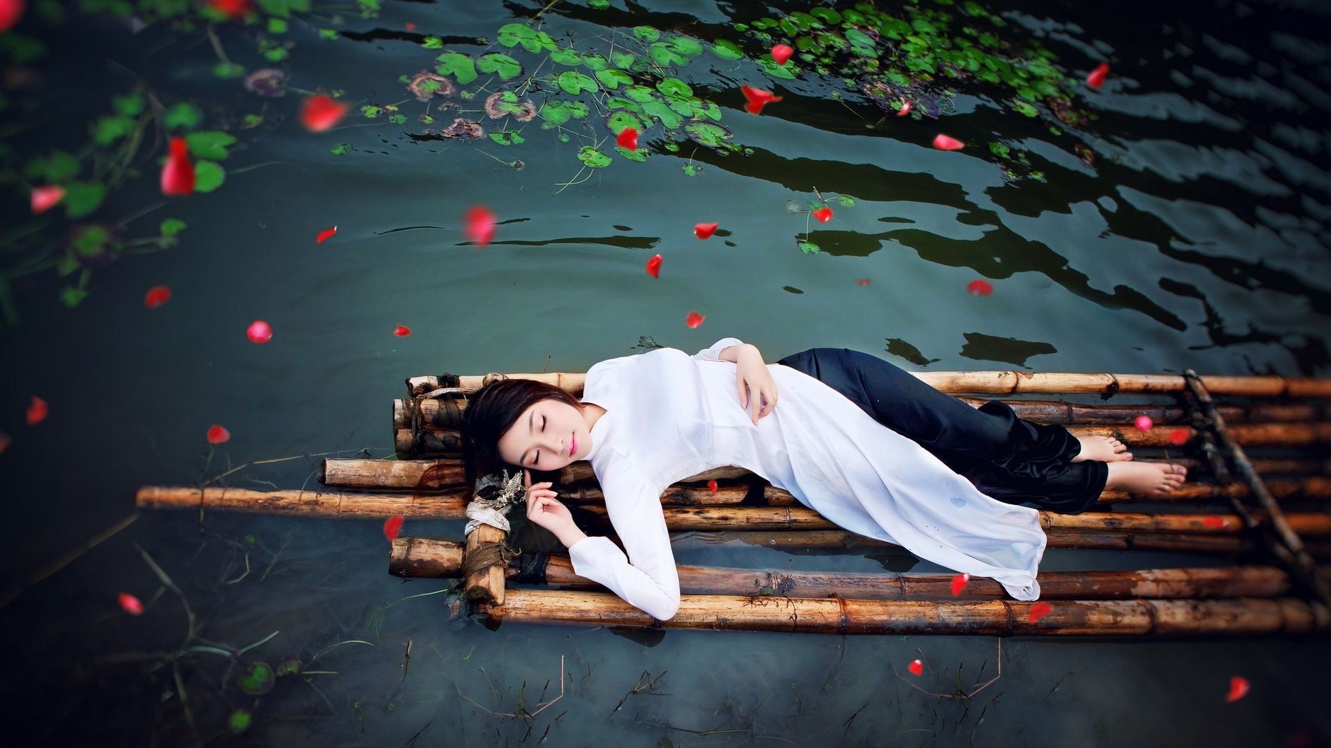 Wallpaper, women outdoors, model, long hair, closed eyes, water, nature, brunette, barefoot, Asian, lying on back, bamboo, flower petals, entertainment, raft, color, stage, darkness, 1920x1080 px, performance art, performing arts 1920x1080