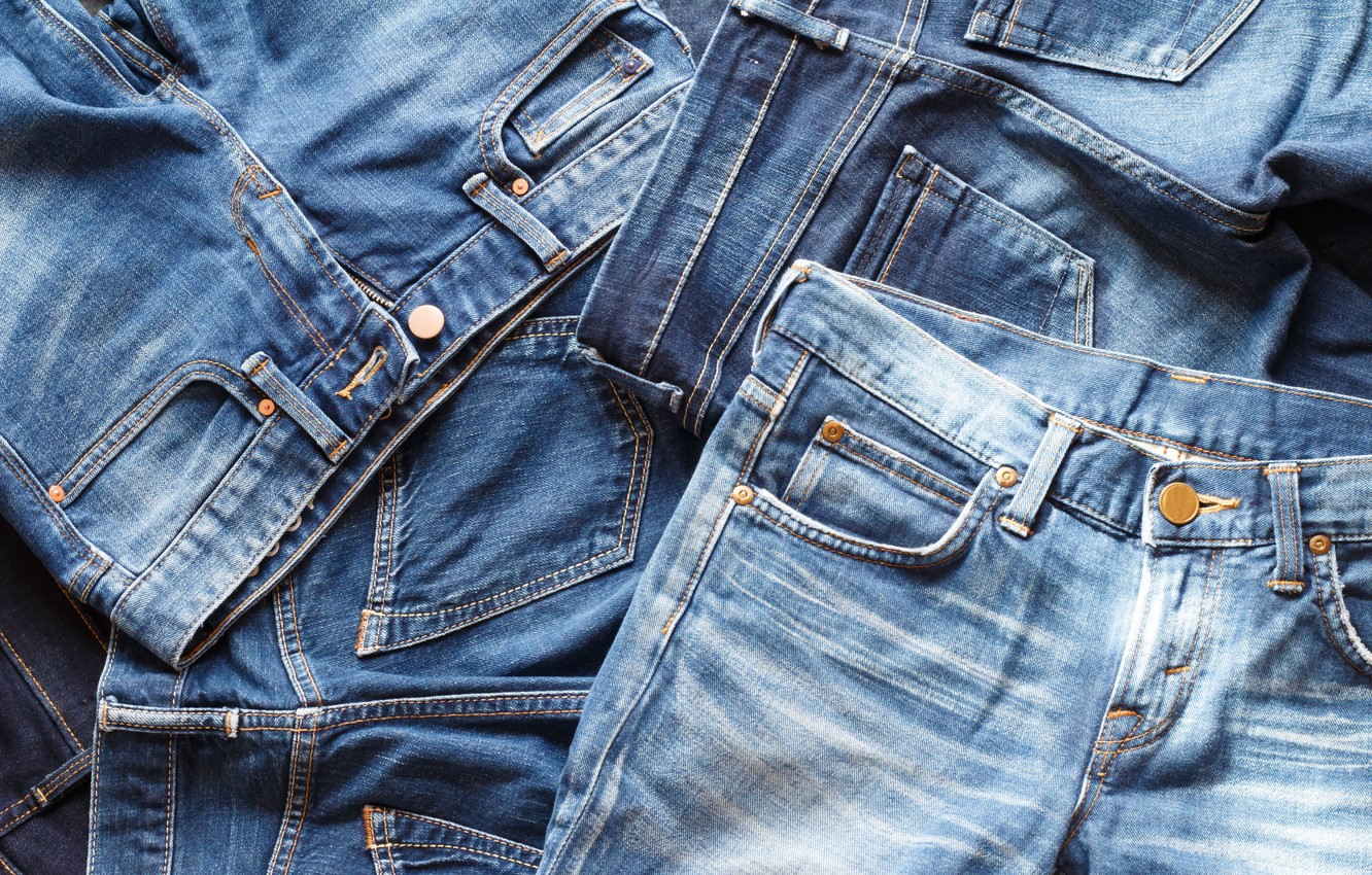 Premium Photo | Jeans denim, pants front pockets, seams with orange  threads, close-up macro view