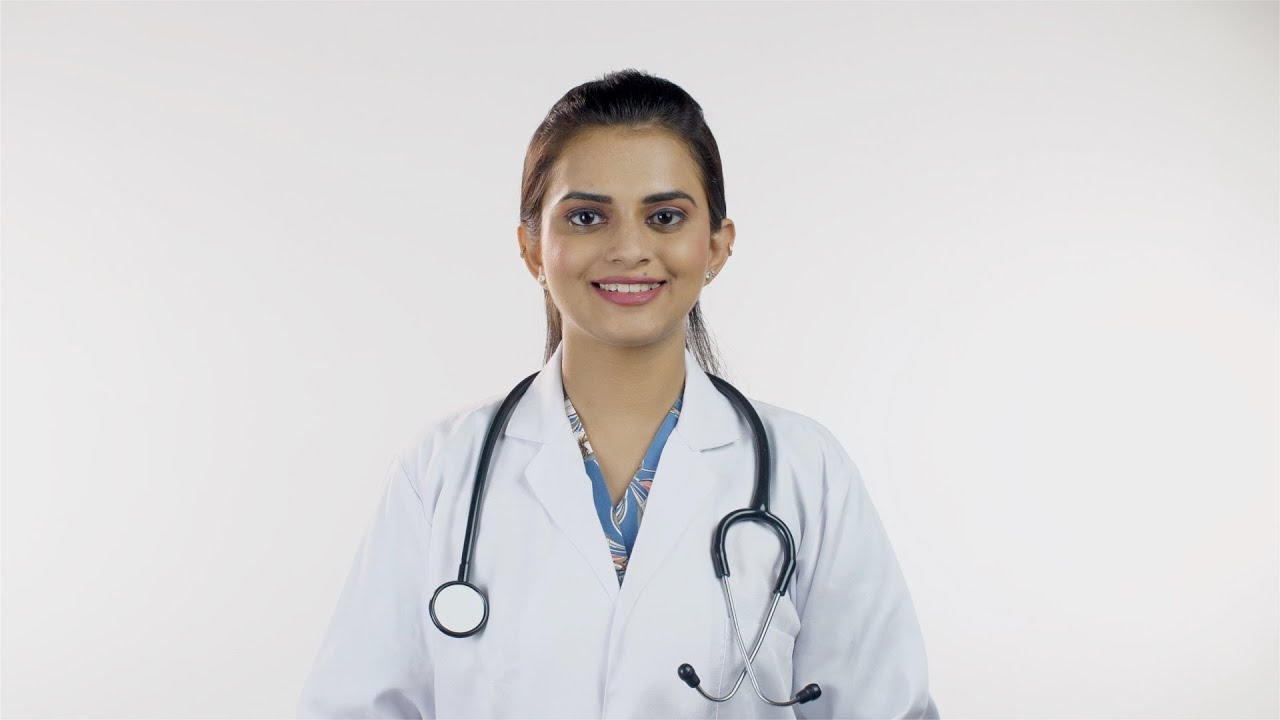 Young Female Doctor Happily Smiling In White Coat Stock Video