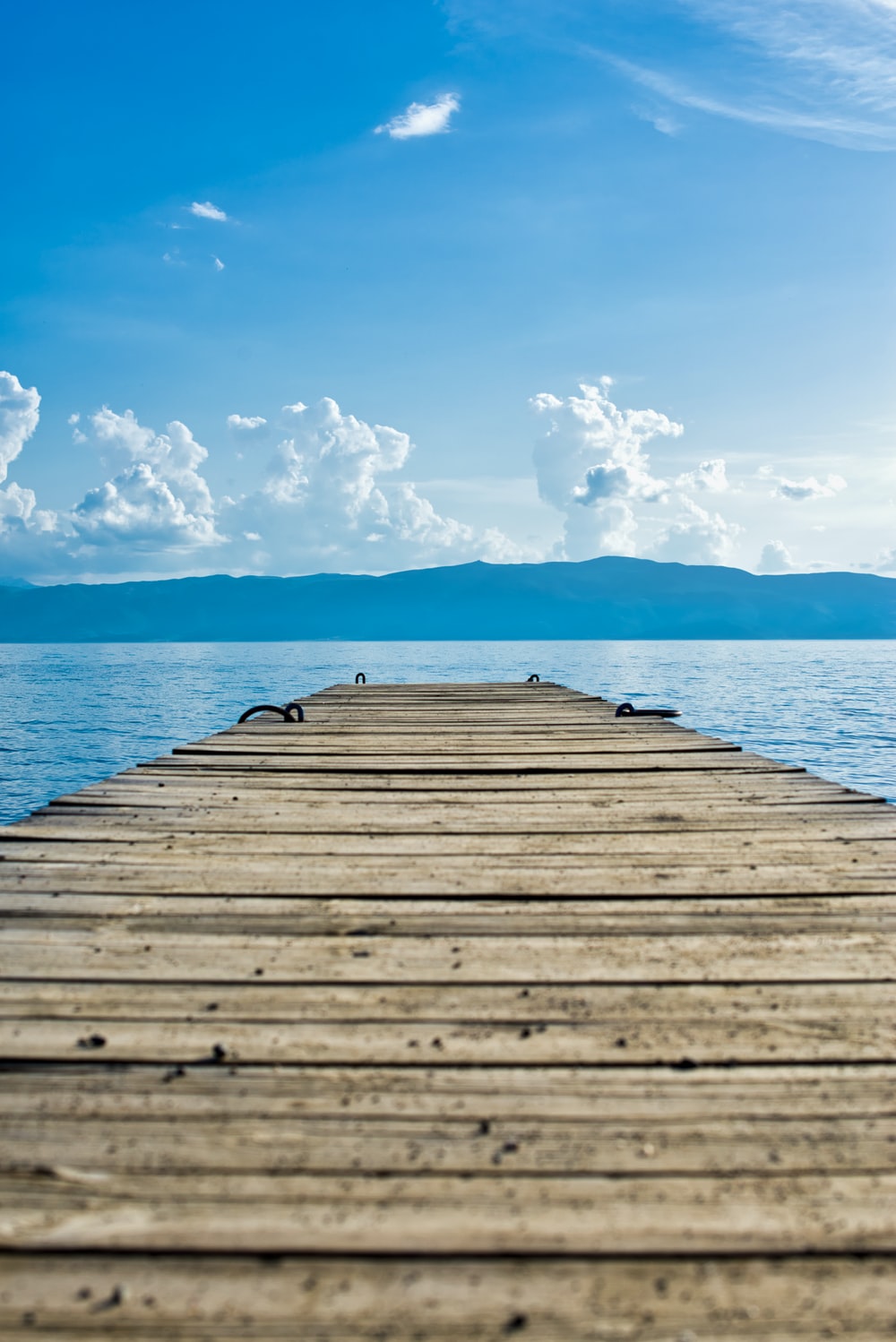 brown wooden dock on body of water photo