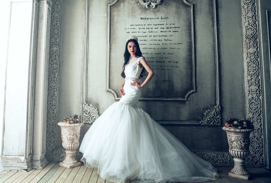 Woman Wearing White Wedding Gown Standing Beside Gray Painted Wall · Free