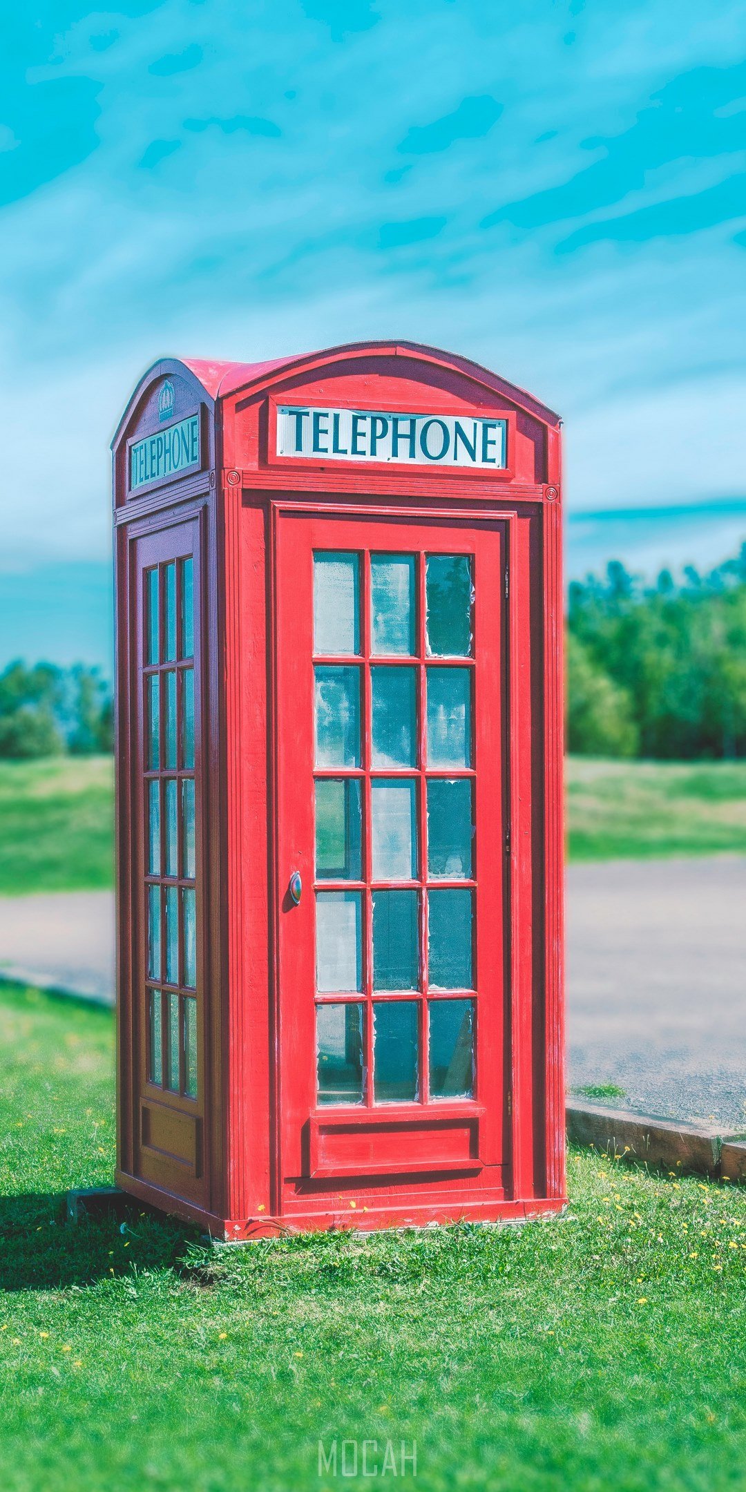 a red telephone booth sits on green grass against a blue sky, telephone booth in grass, Samsung Galaxy Note 10 Lite wallpaper hd, 1080x2400. Mocah HD Wallpaper