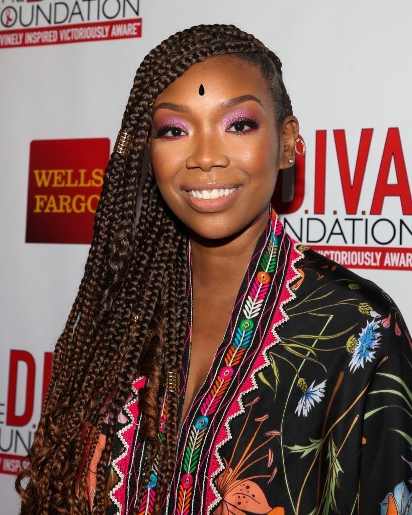 See New Photo of 'Moesha' Star Brandy Norwood Posing with Long Braids in a Striped Dress