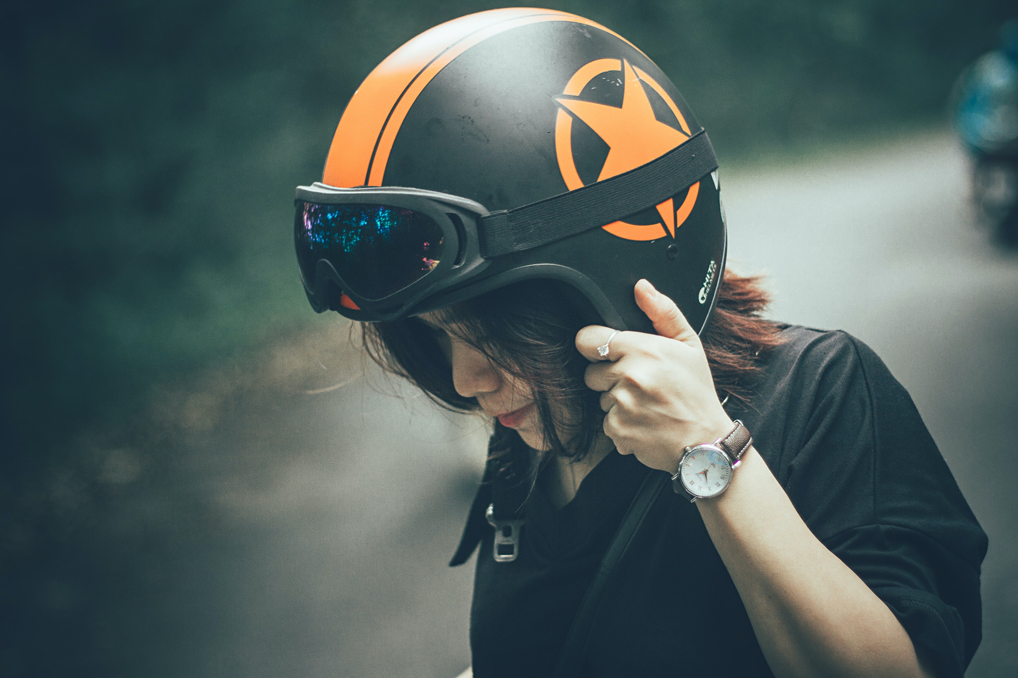 Woman Wearing Black Shirt And Black And Orange Half Face Helmet · Free