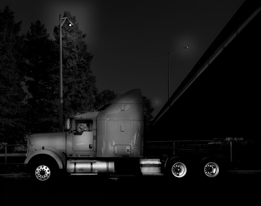 Curl Up Next to a Trucker in These Night Photo of Rest Stops