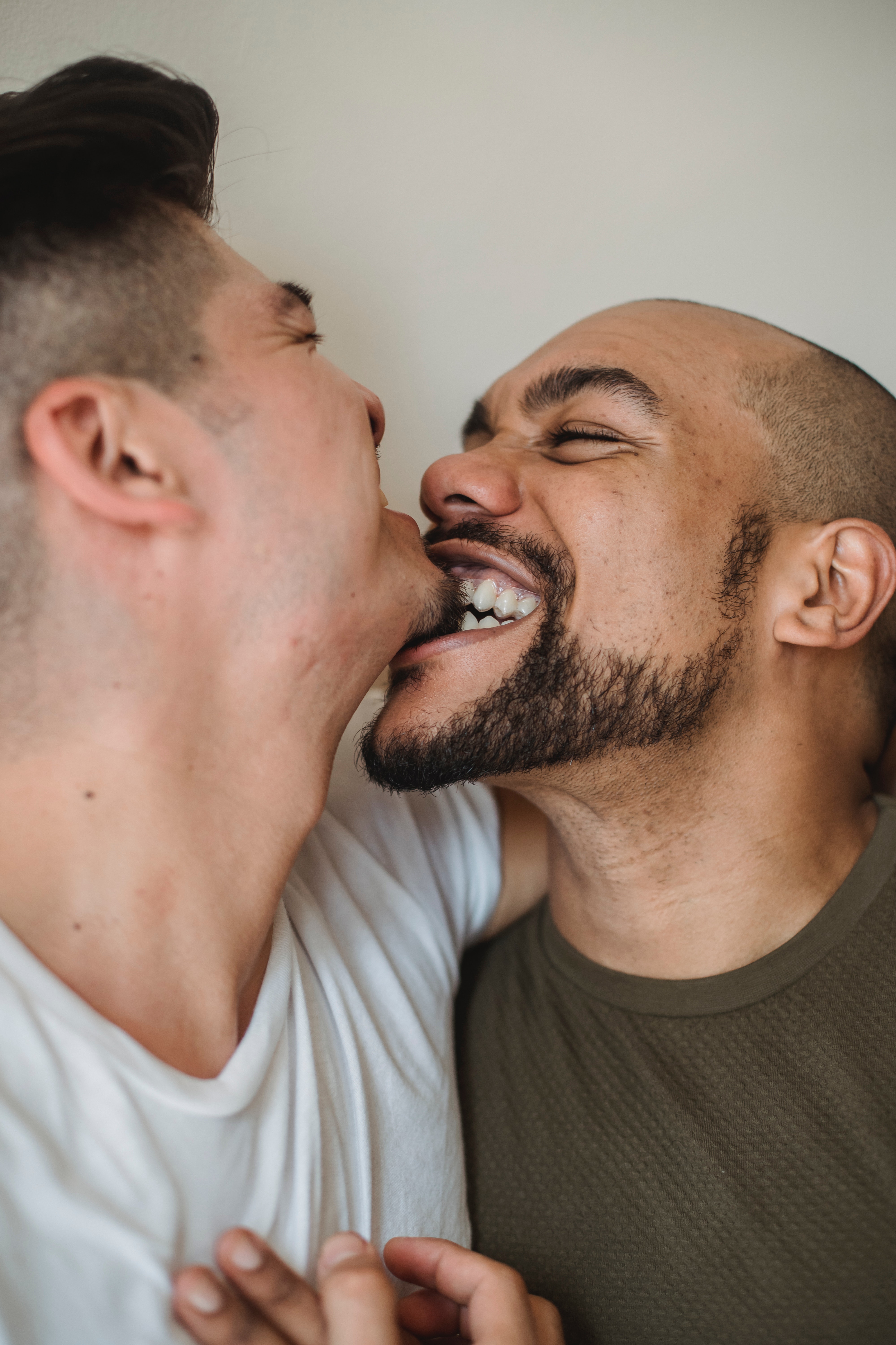 Man Biting Another Man's Chin · Free