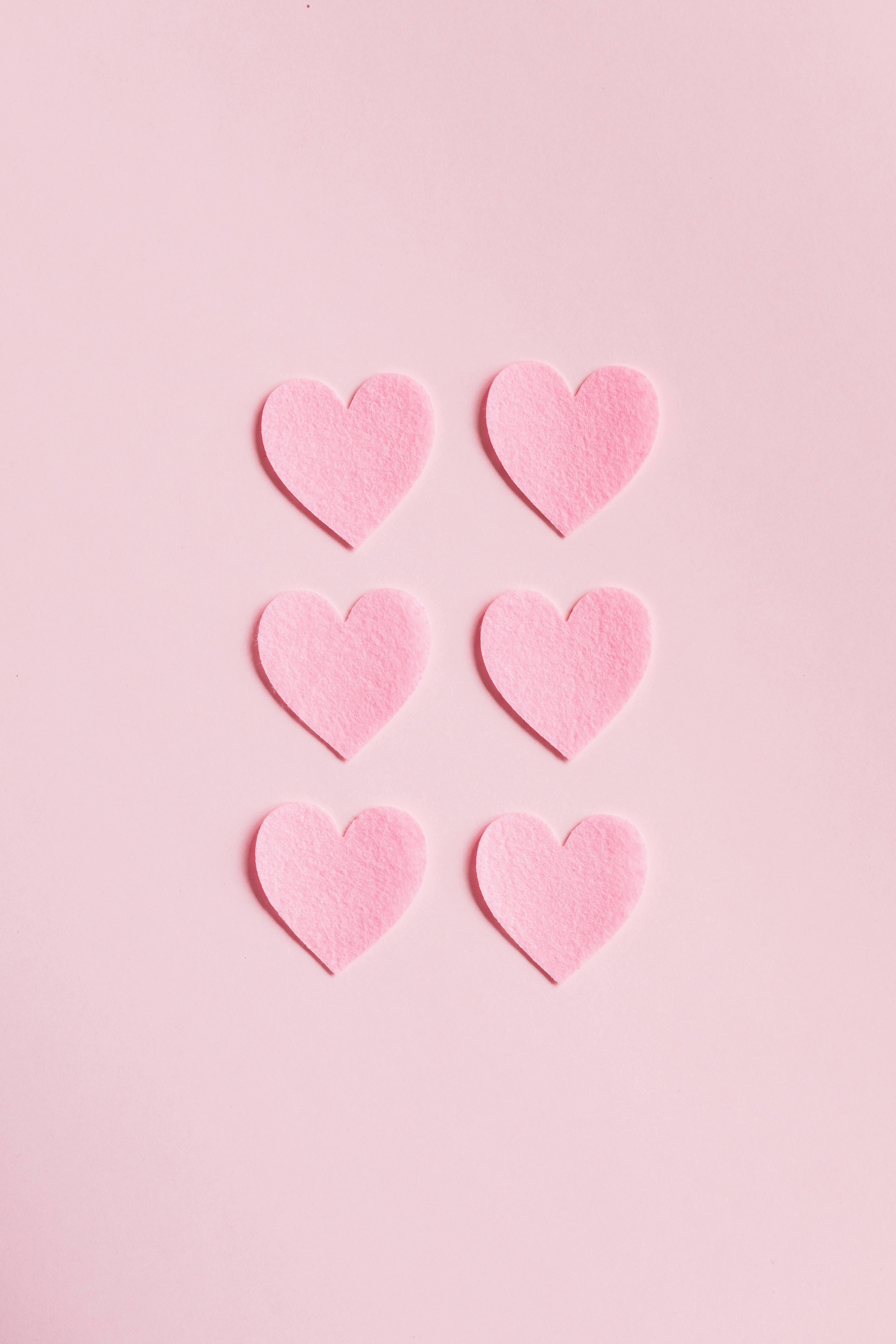 Heart Shaped Cutouts on Pink Background · Free