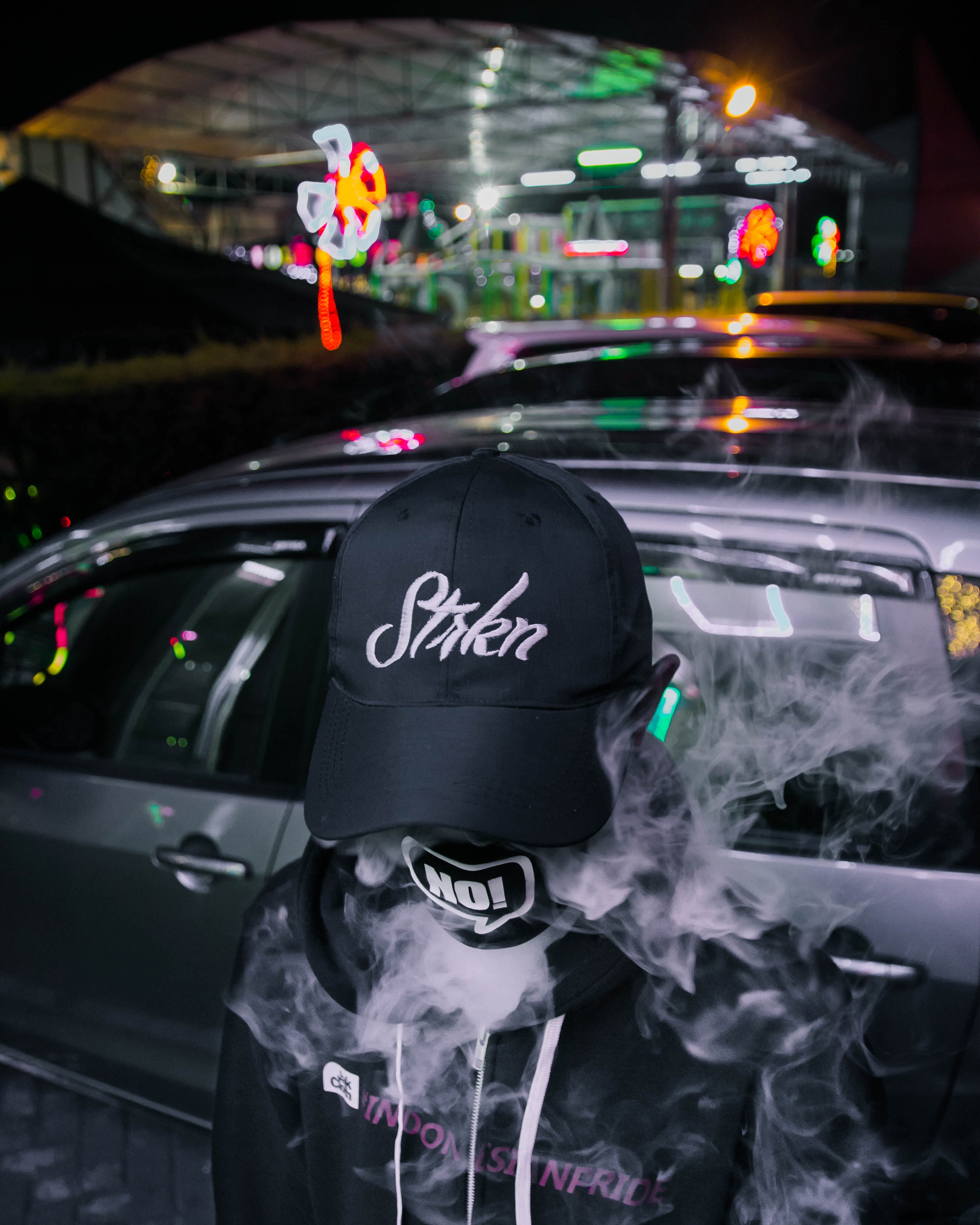 Wallpaper / person in black and white vaping in fashion labels with colorful neon signs in the background, break the limit 4k wallpaper free download