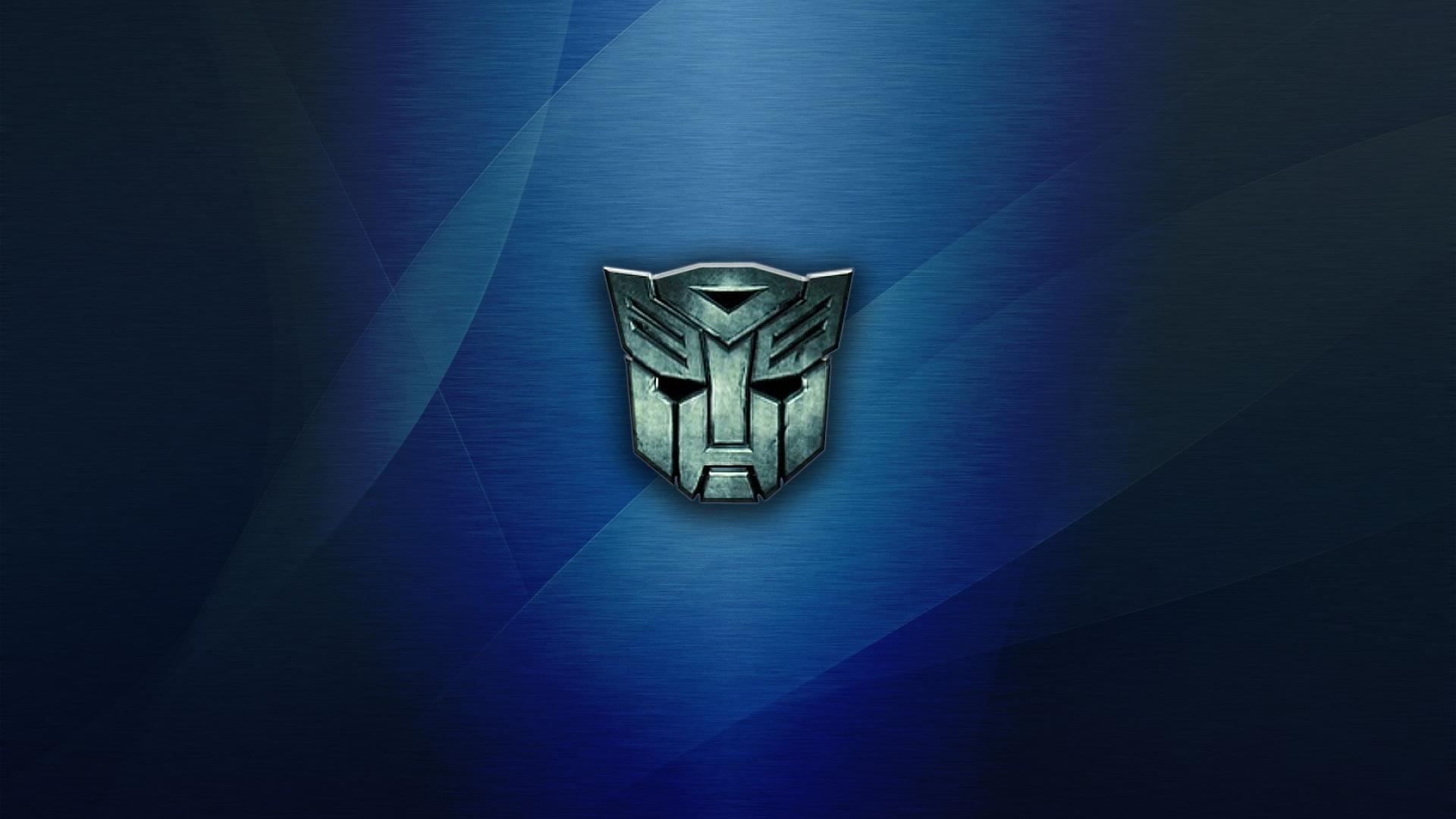 cartoon logo transformers blue background widescreen HD Wallpaper