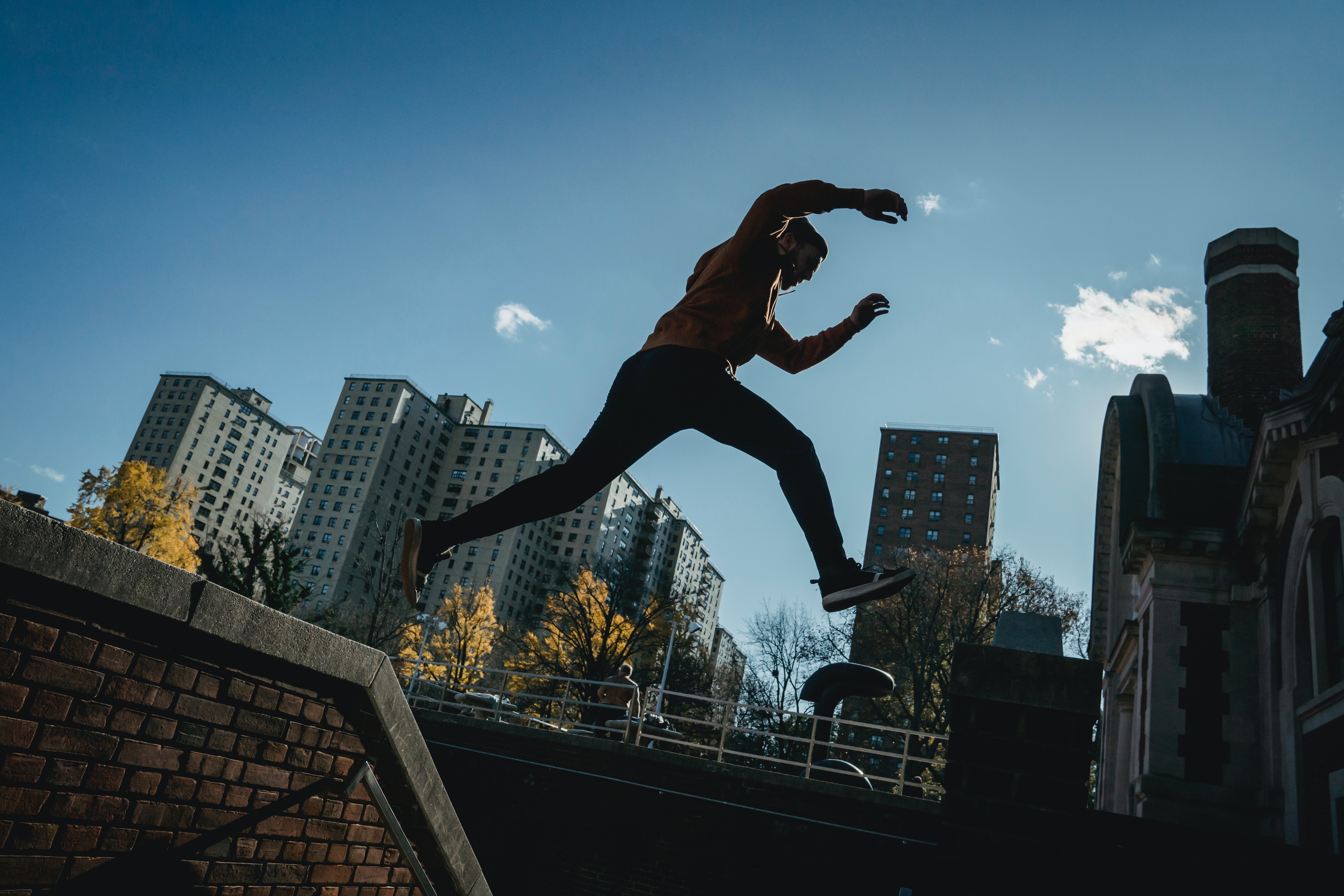 Energetic man jumping on street · Free