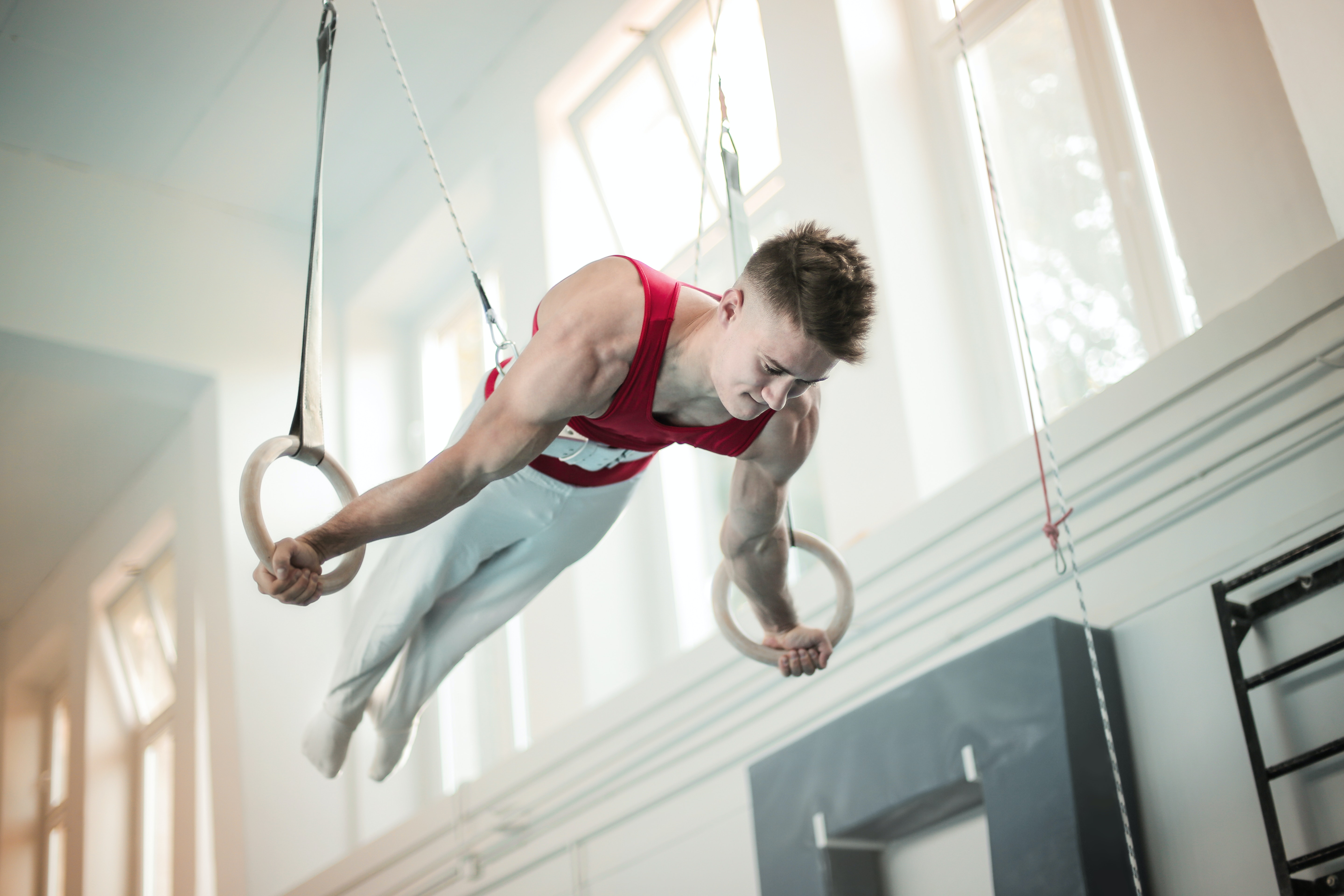 Photo of Male Gymnast Practicing on Gymnastic Rings · Free