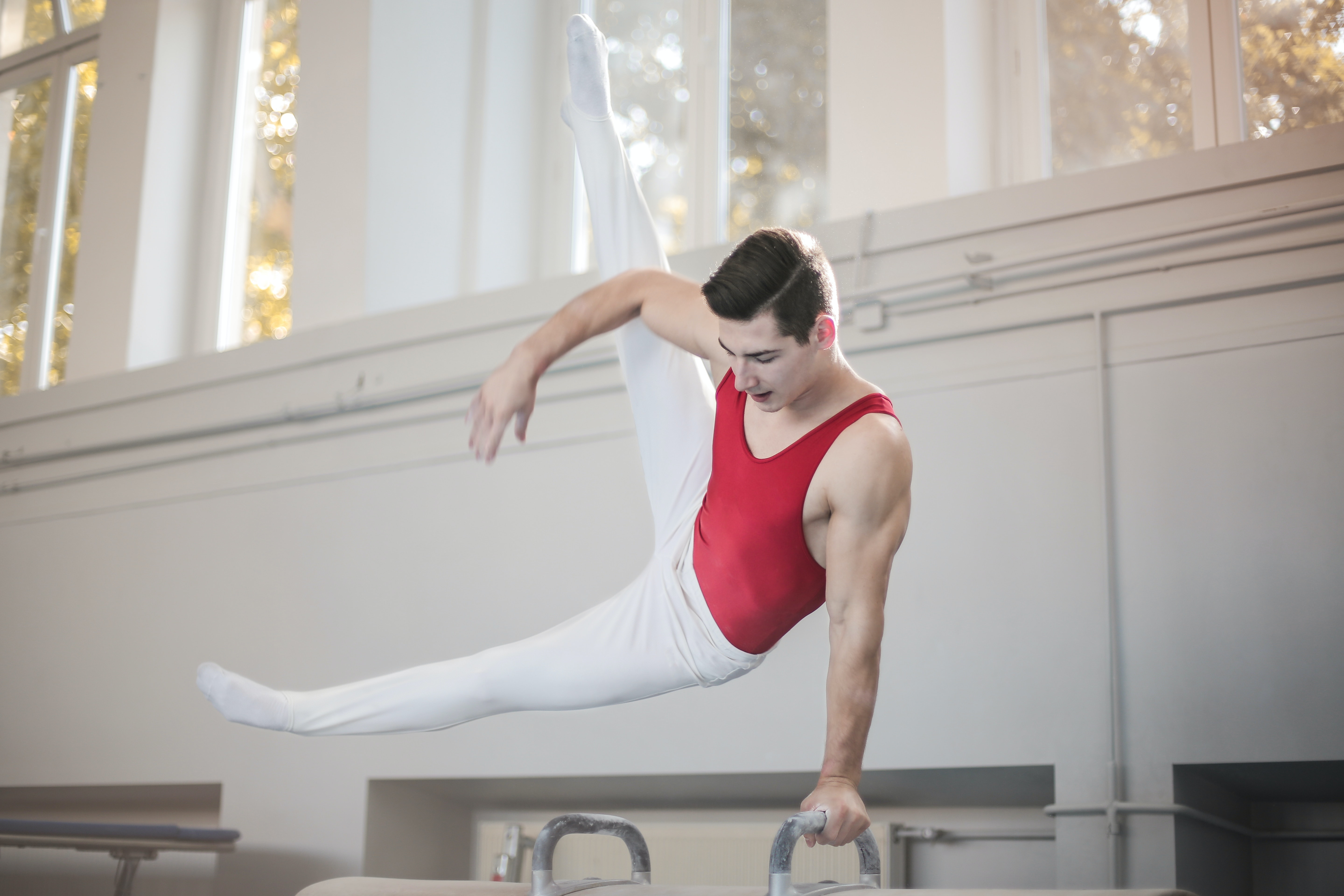 Photo of Male Gymnast Practicing in Gym · Free