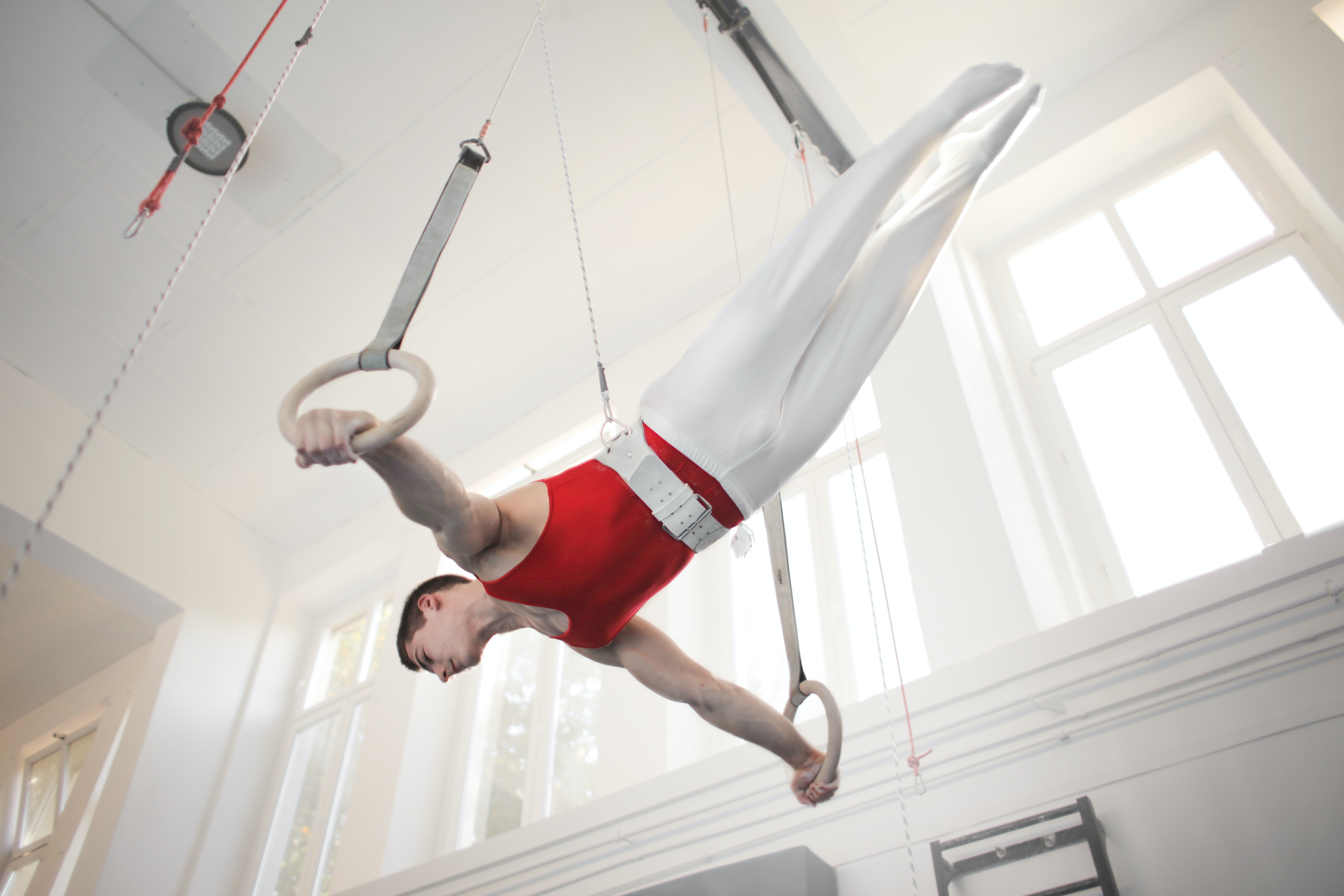 Photo of Male Gymnast Practicing on Gymnastic Rings · Free