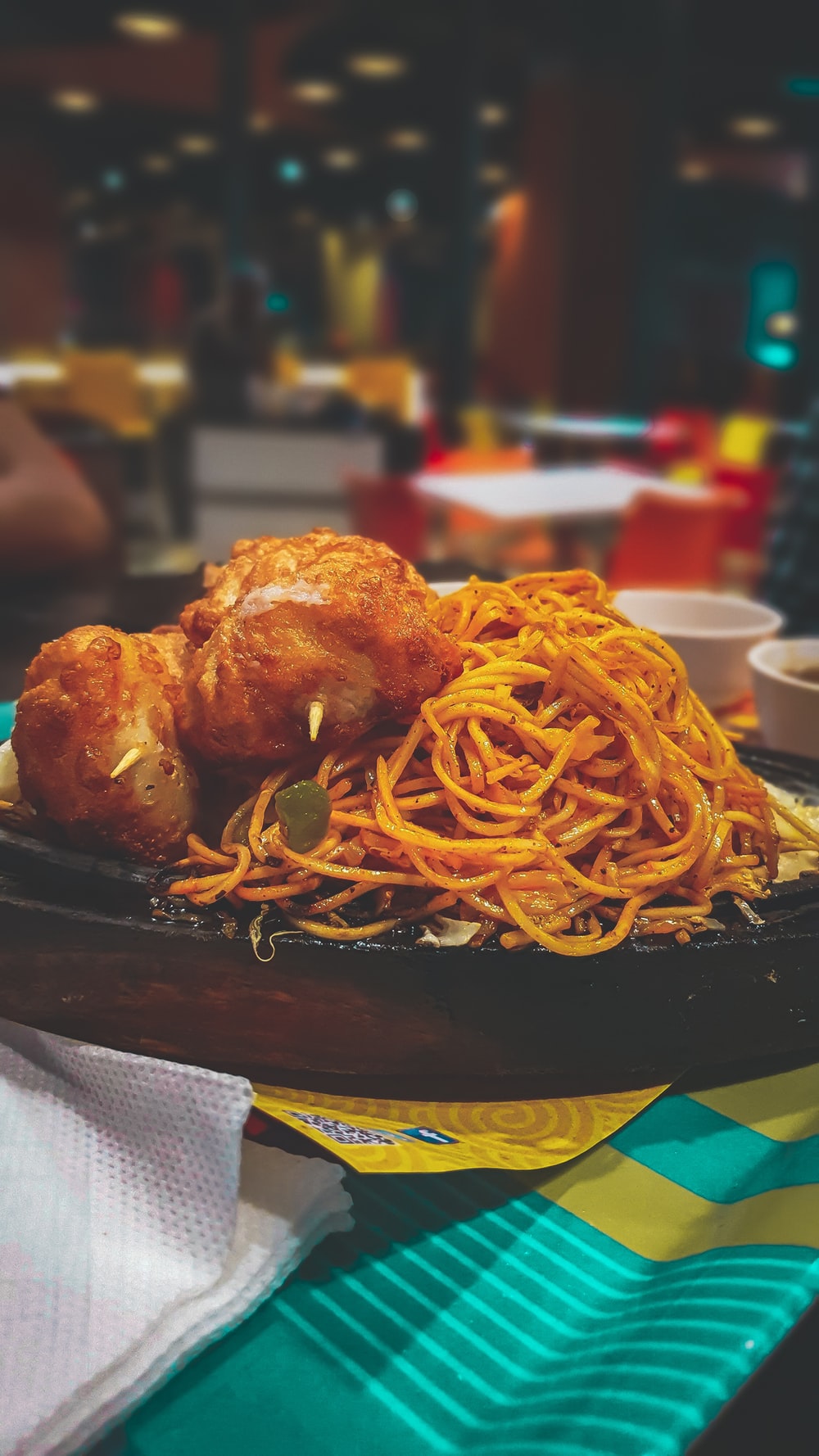 spaghetti and fried chicken platter on table photo