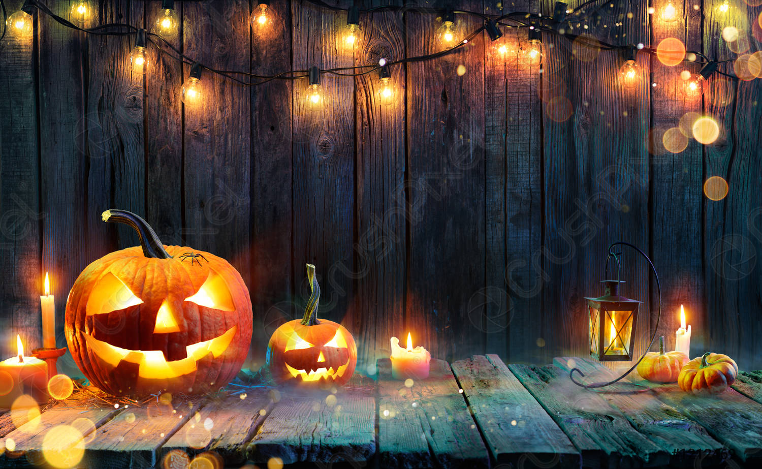 Halloween O' Lanterns And String Lights On
