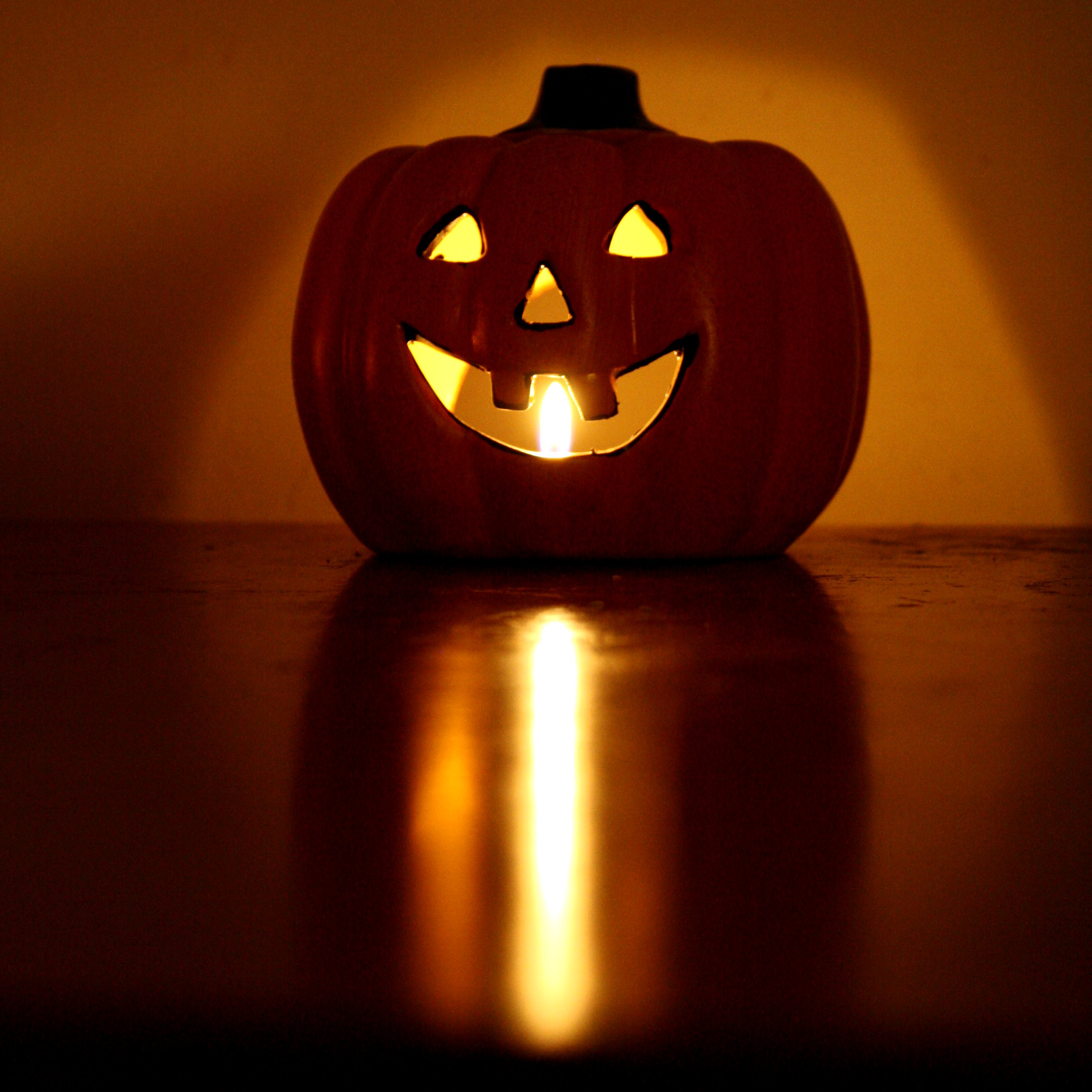 Halloween Pumpkin Candle with Burning Flame Picture. Free Photograph. Photo Public Domain