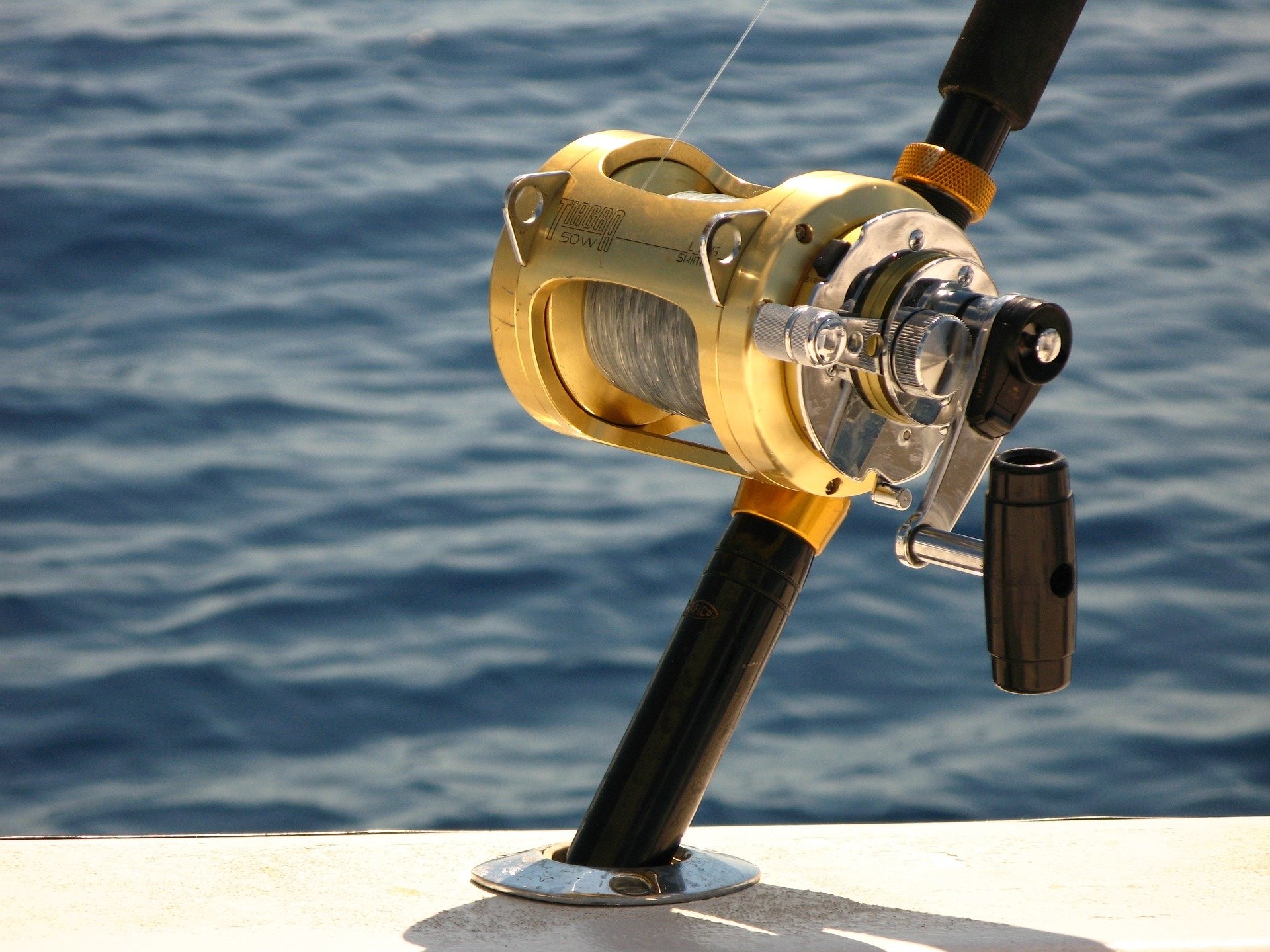 Deep sea fishing rod and reel HD Wallpaper