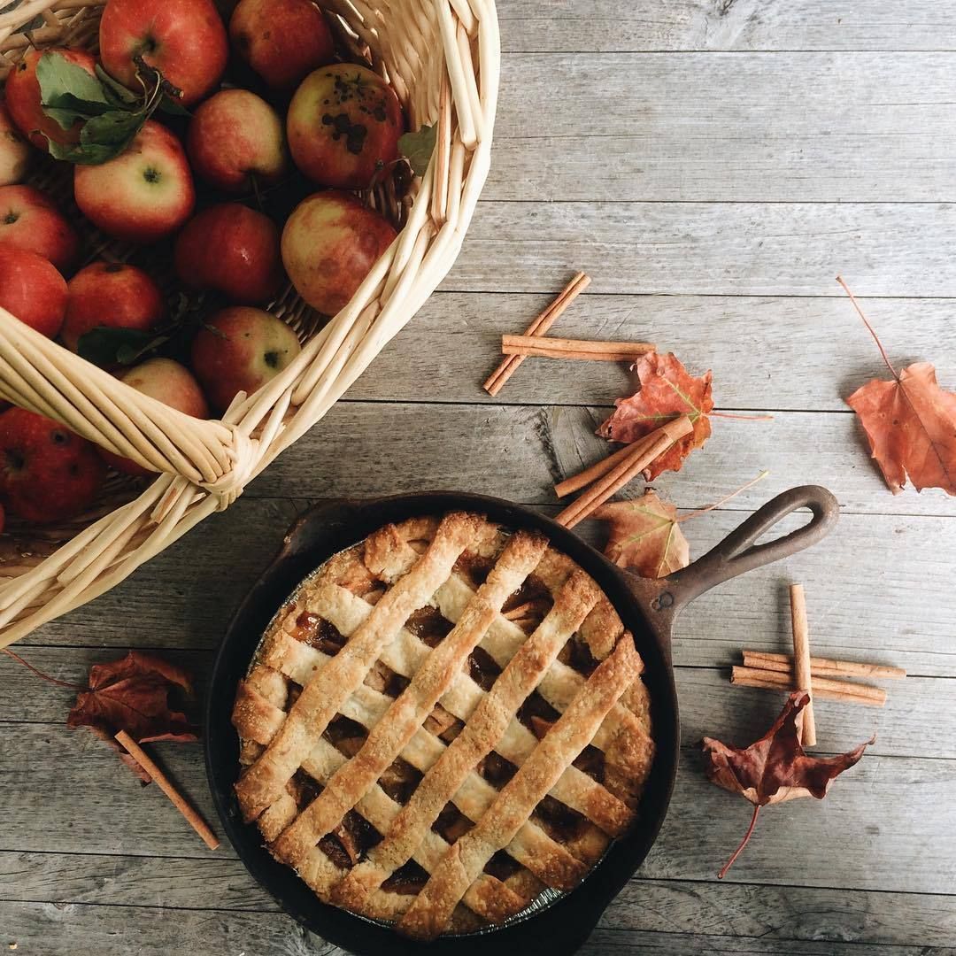 Gorgeous fall inspiration with this country style #applepie with lattice crust in a cast iron pan and basket of freshly picked apple. Food, Pumpkin spice, Seasons