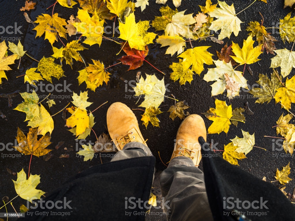 Man Walking In The City On Autumn Leaves Image Now