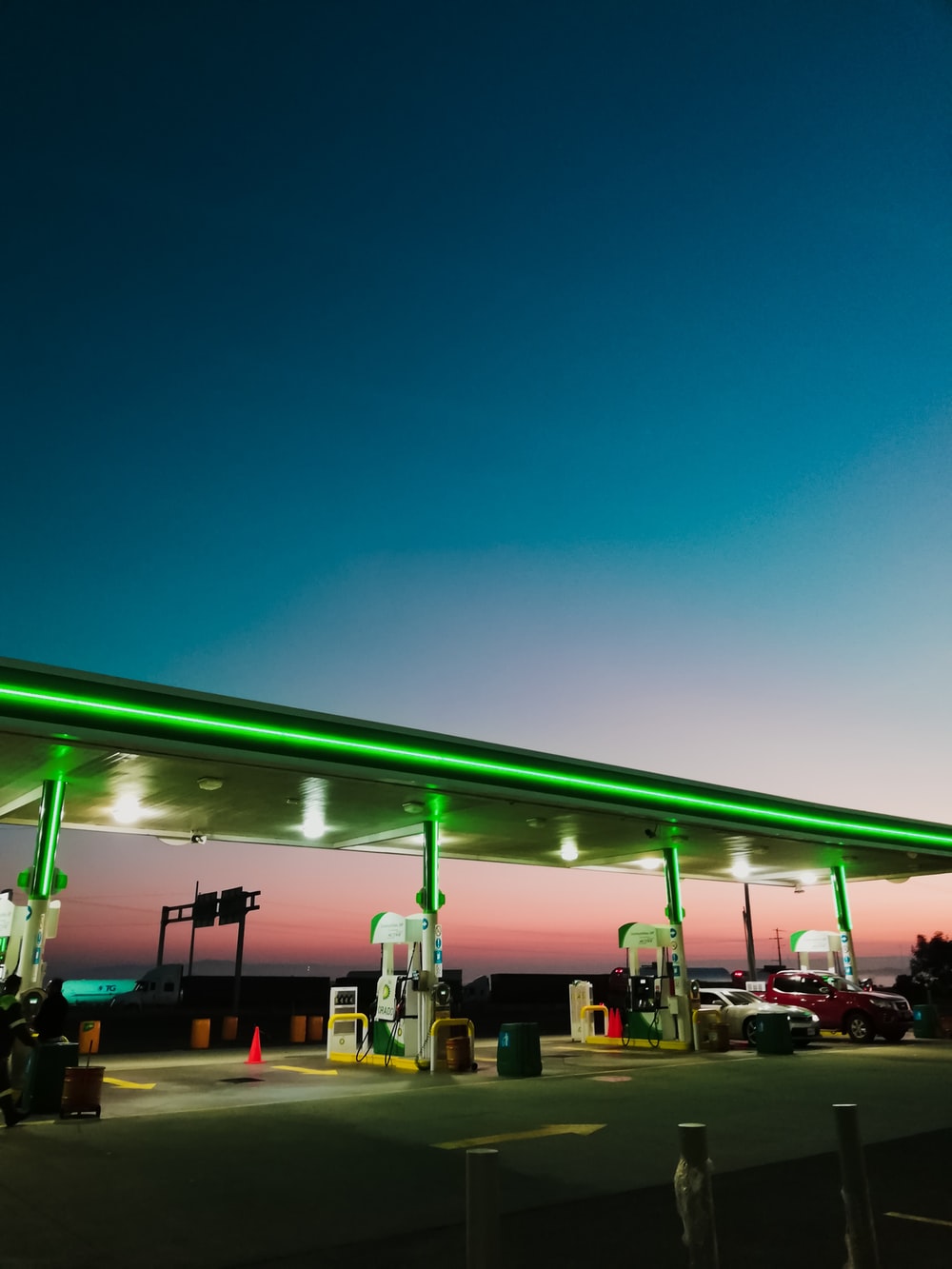 lighted gasoline station at night photo