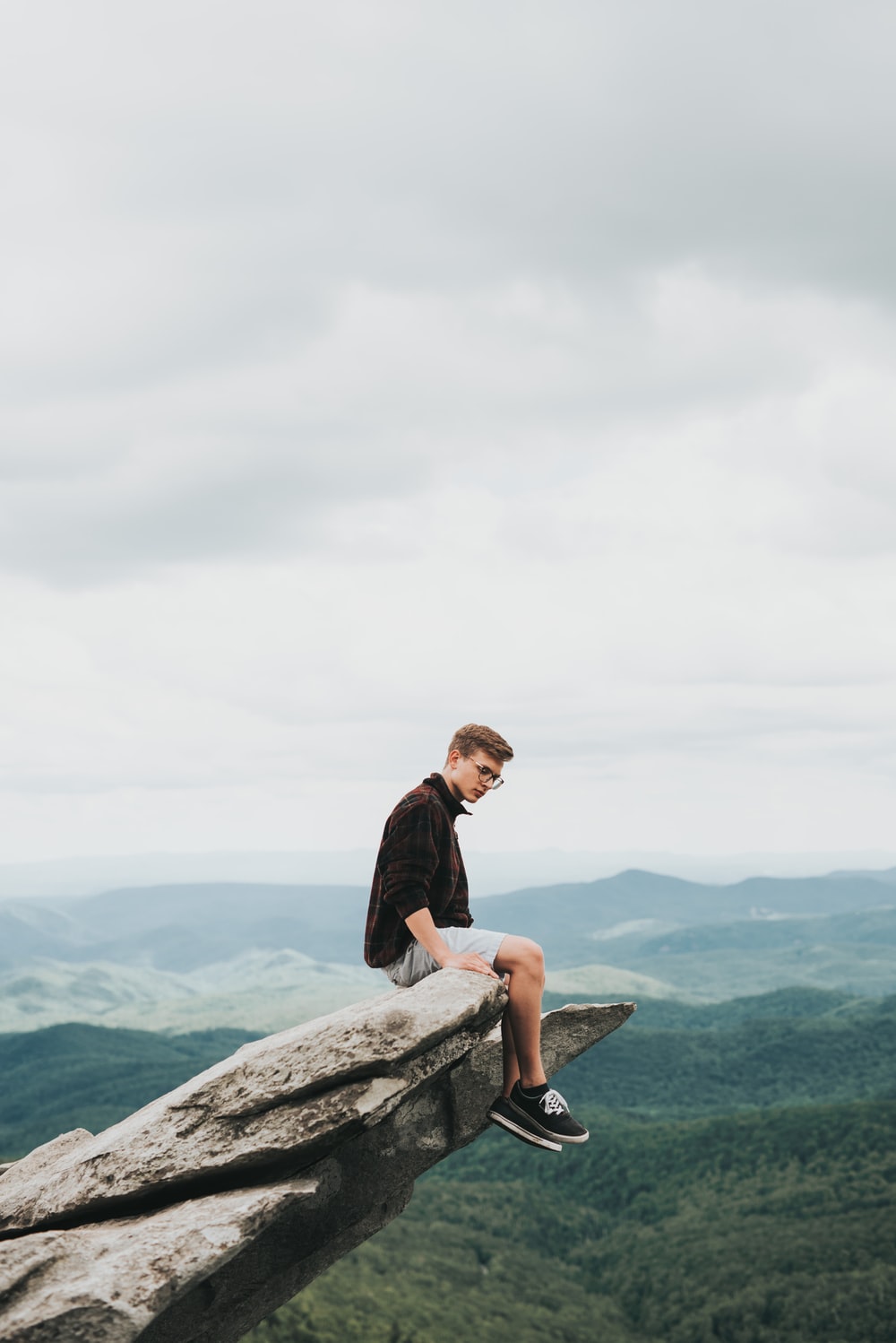 Sitting On Rock Picture. Download Free Image