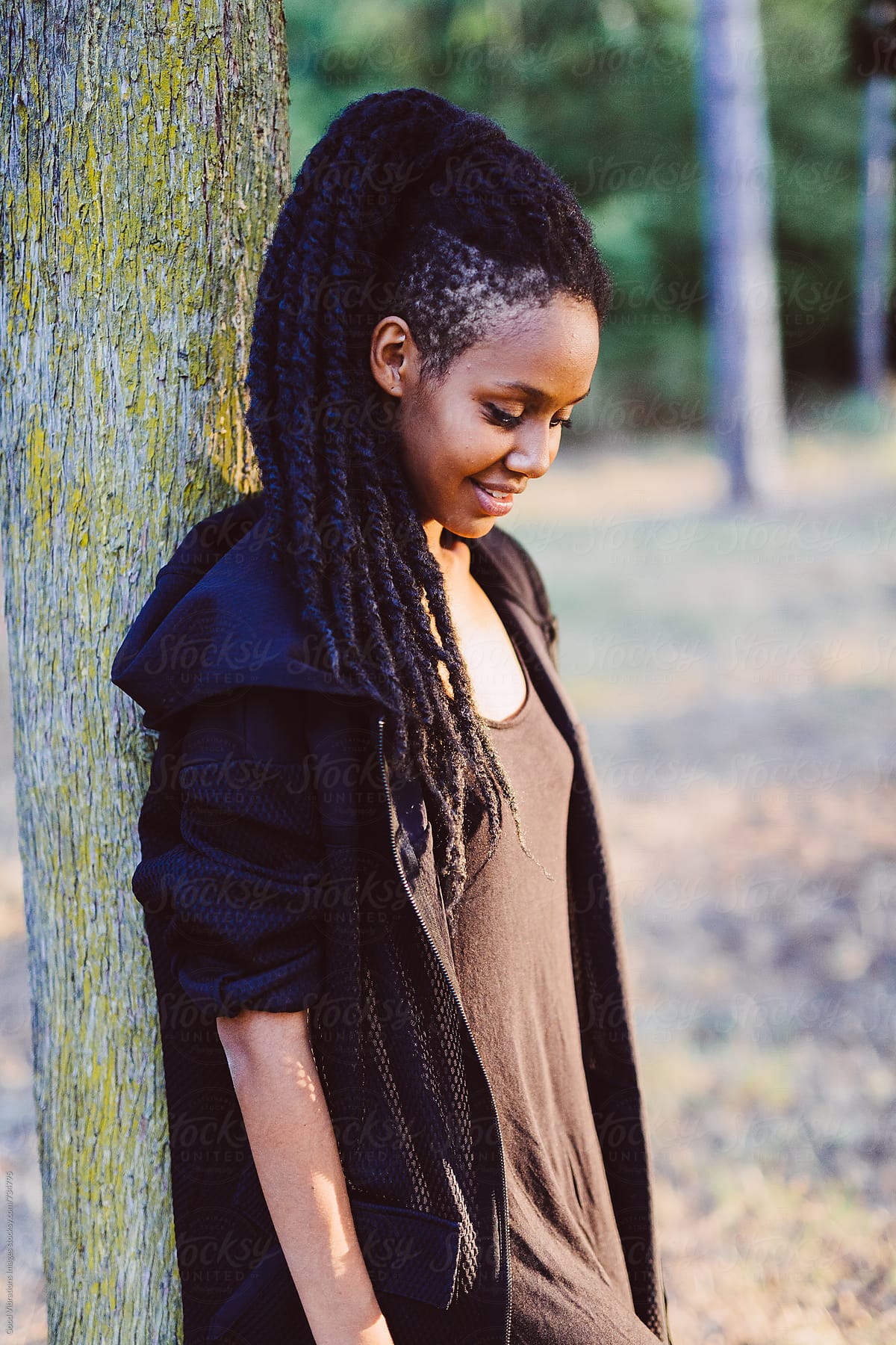 Rasta Woman With Dreadlocks Posing In The Nature At Sunset