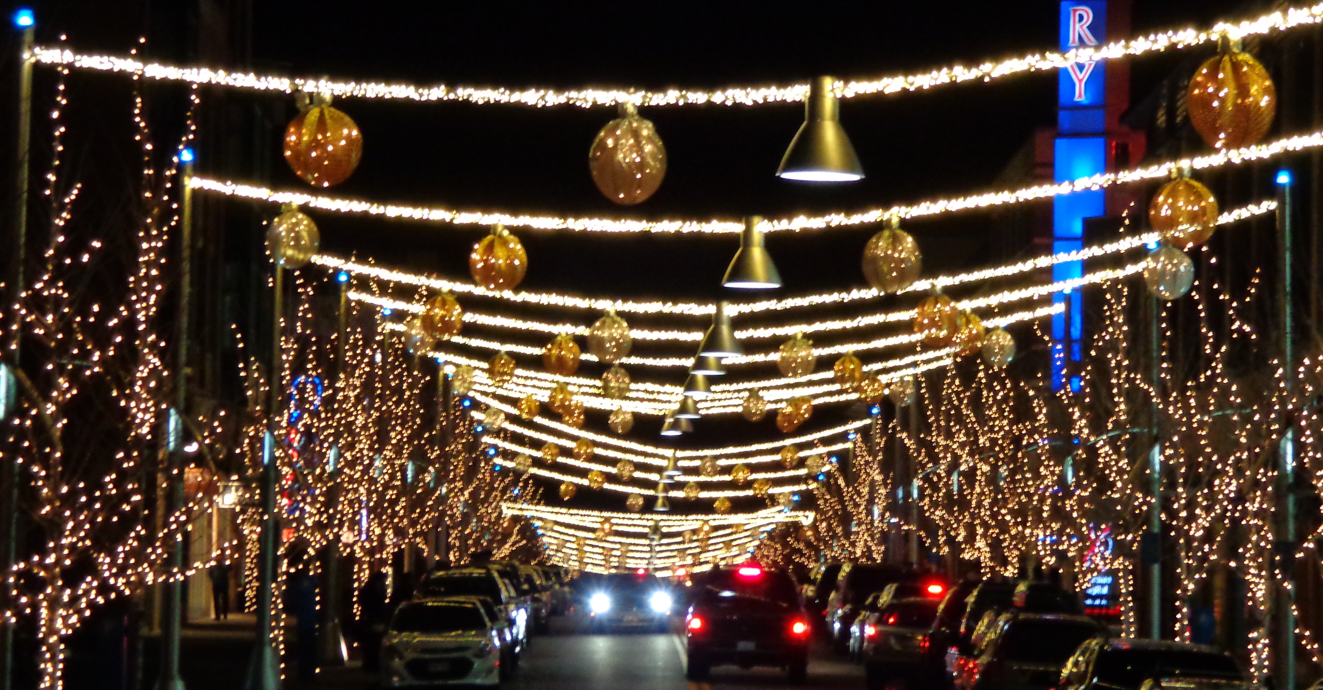 Holiday Night Street Scene with Christmas Lights Picture. Free Photograph. Photo Public Domain