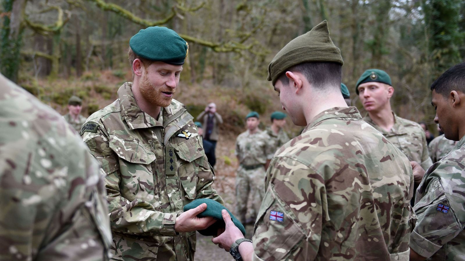 Prince Harry presents Royal Marines with green berets