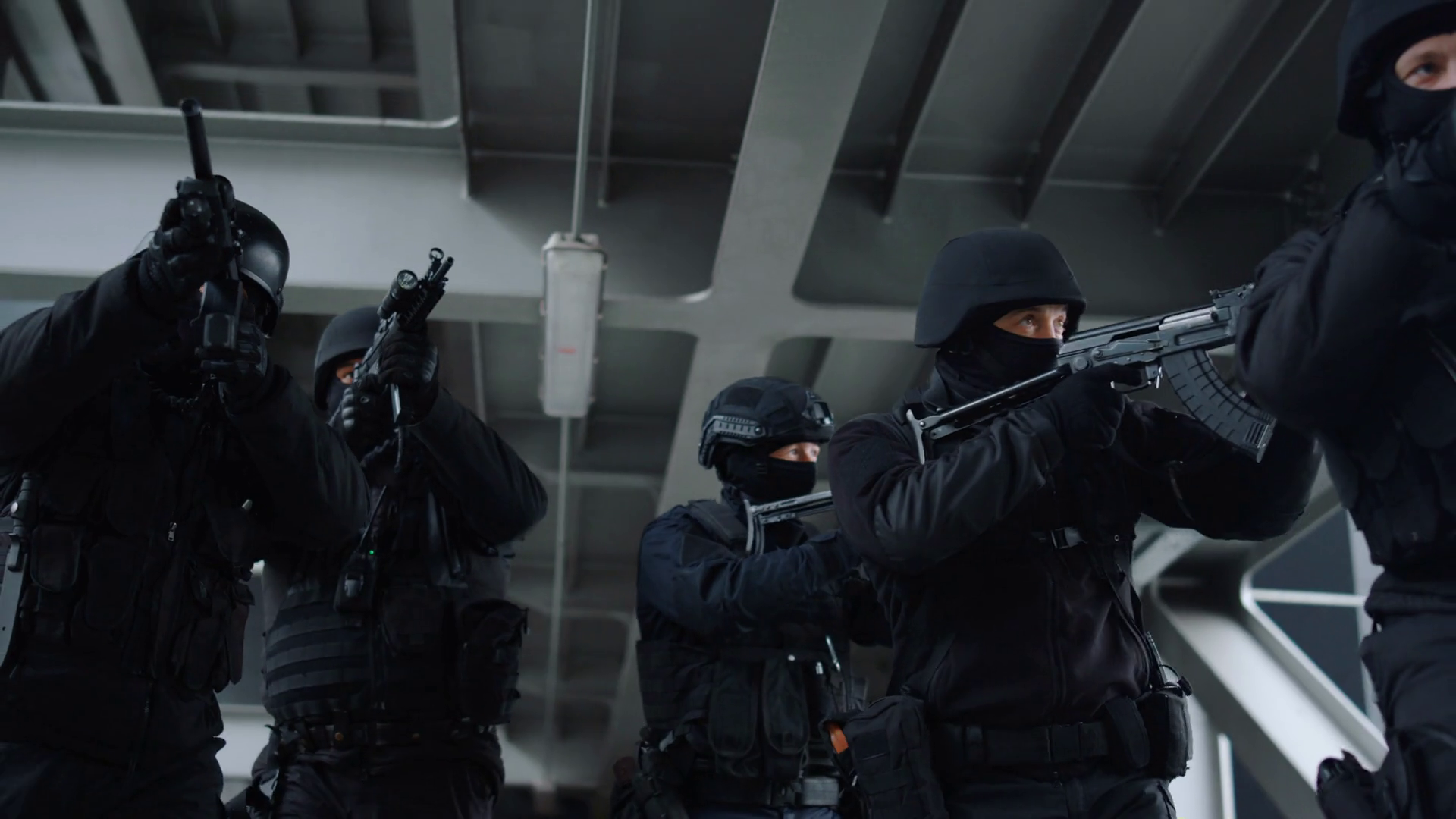 Special Ops Police Team Protecting Urban Building With Assault Rifles. Masked Military Soldiers Moving Forwards Along Construction Bridge. SWAT Team Members Looking At Scope Of Firearms Stock Video Footage 00:16 SBV 346484844