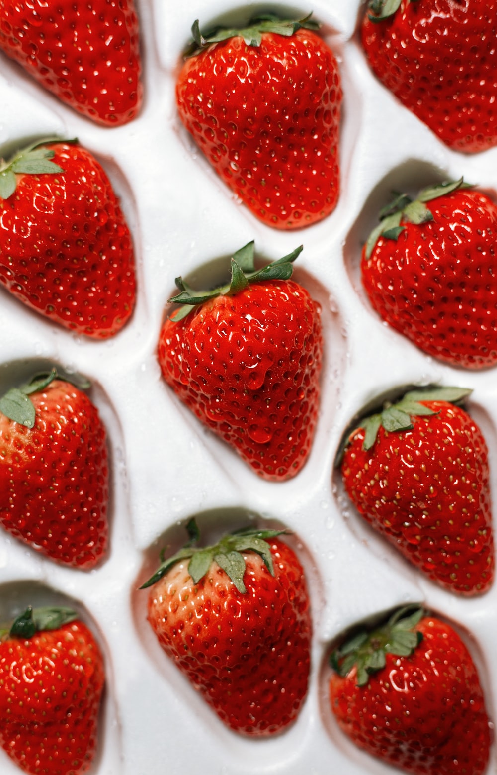 strawberries on white ceramic plate photo